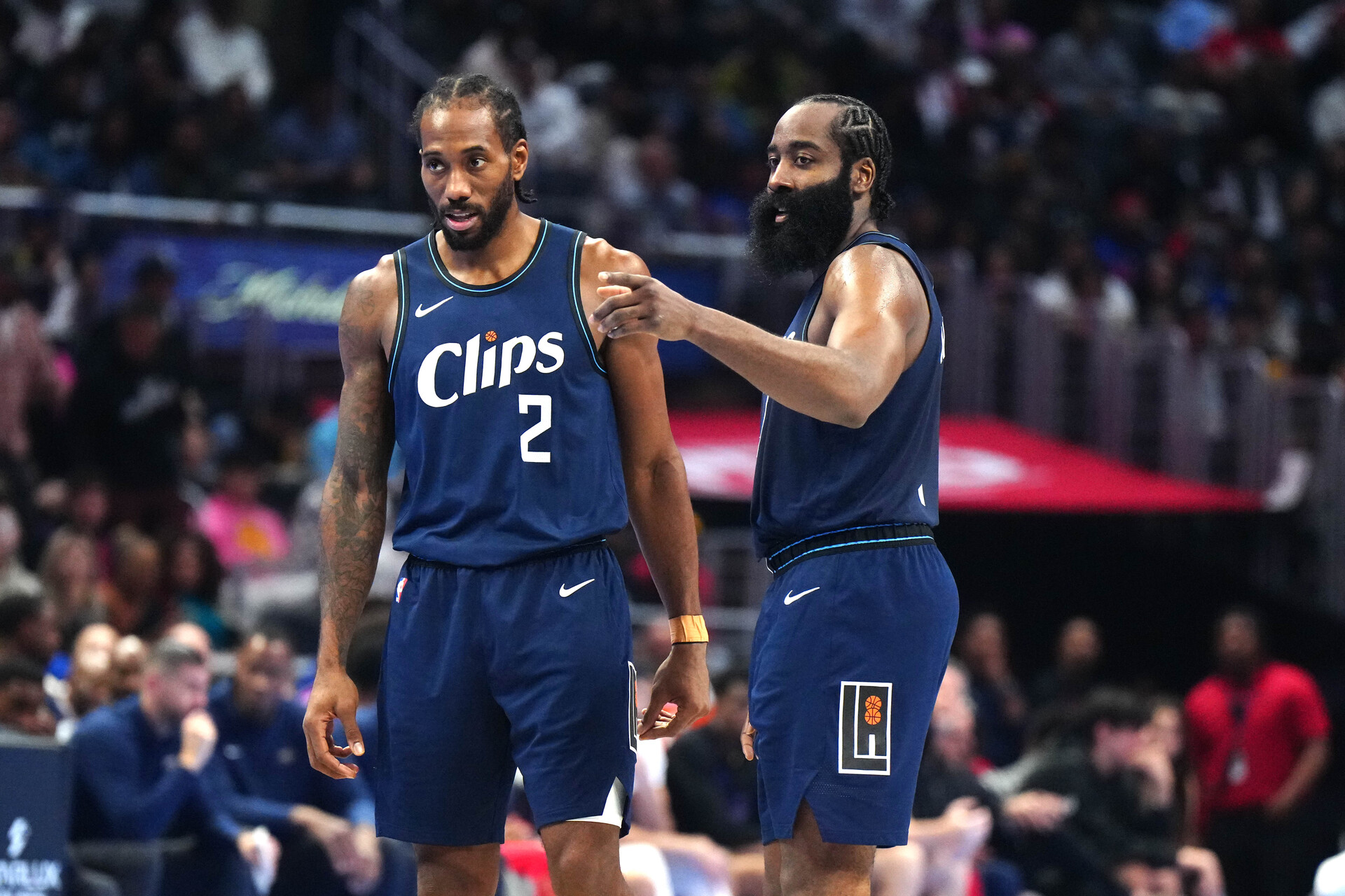 Nov 24, 2023; Los Angeles, California, USA; LA Clippers forward Kawhi Leonard (2) and guard James Harden (1) talk during their game against the New Orleans Pelicans in the second half at Crypto.com Arena