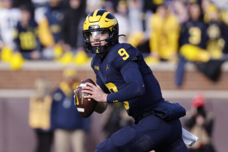 Nov 25, 2023; Ann Arbor, Michigan, USA; Michigan Wolverines quarterback J.J. McCarthy (9) rolls out to pass in the first half against the Ohio State Buckeyes at Michigan Stadium.