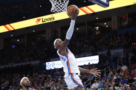 Nov 25, 2023; Oklahoma City, Oklahoma, USA; Oklahoma City Thunder guard Shai Gilgeous-Alexander (2) shoots against the Philadelphia 76ers during the second half at Paycom Center.