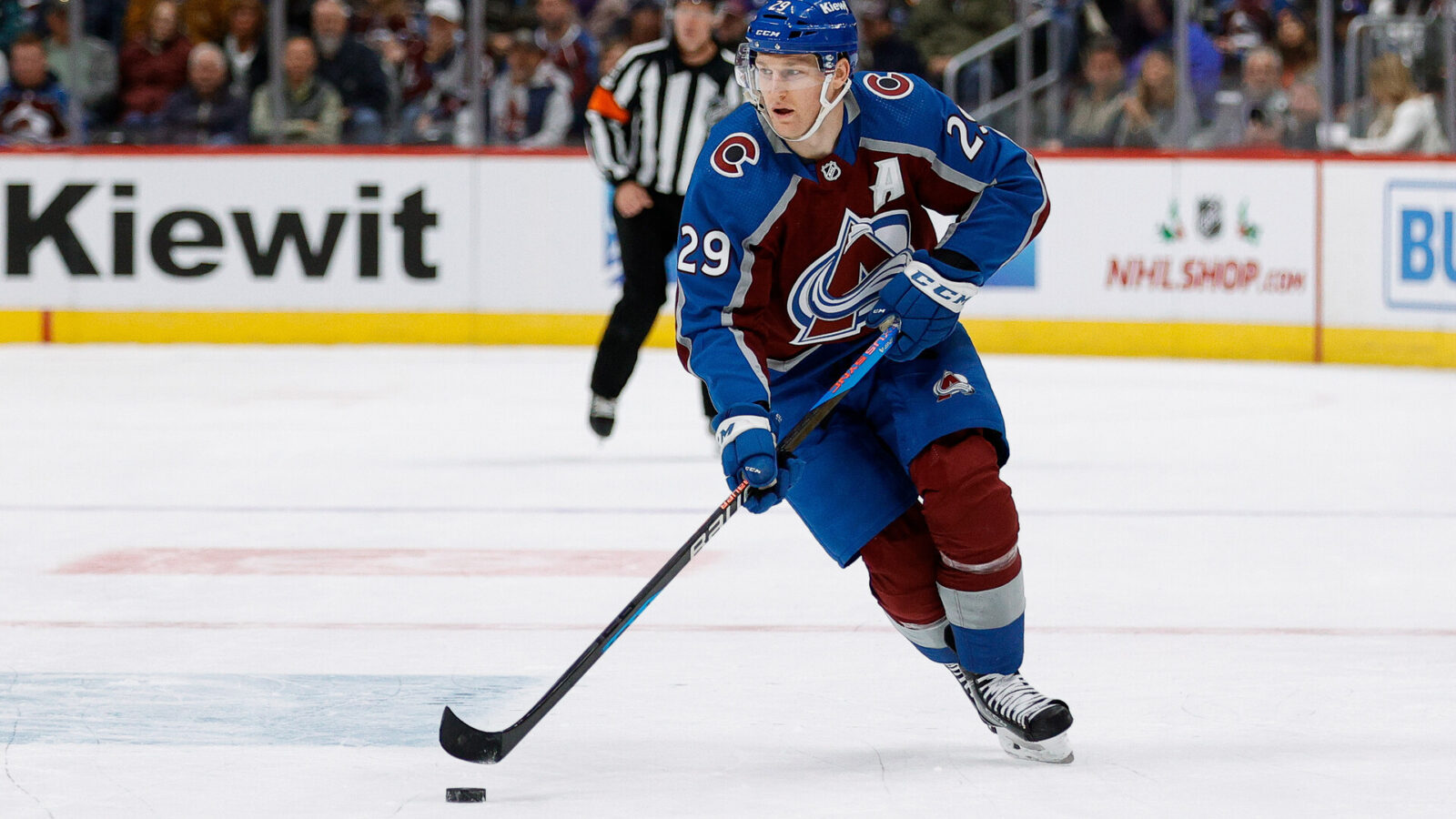 Nov 25, 2023; Denver, Colorado, USA; Colorado Avalanche center Nathan MacKinnon (29) controls the puck in the second period against the Calgary Flames at Ball Arena.
