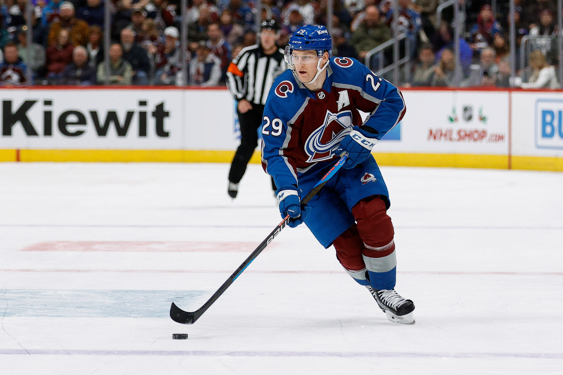 Nov 25, 2023; Denver, Colorado, USA; Colorado Avalanche center Nathan MacKinnon (29) controls the puck in the second period against the Calgary Flames at Ball Arena.