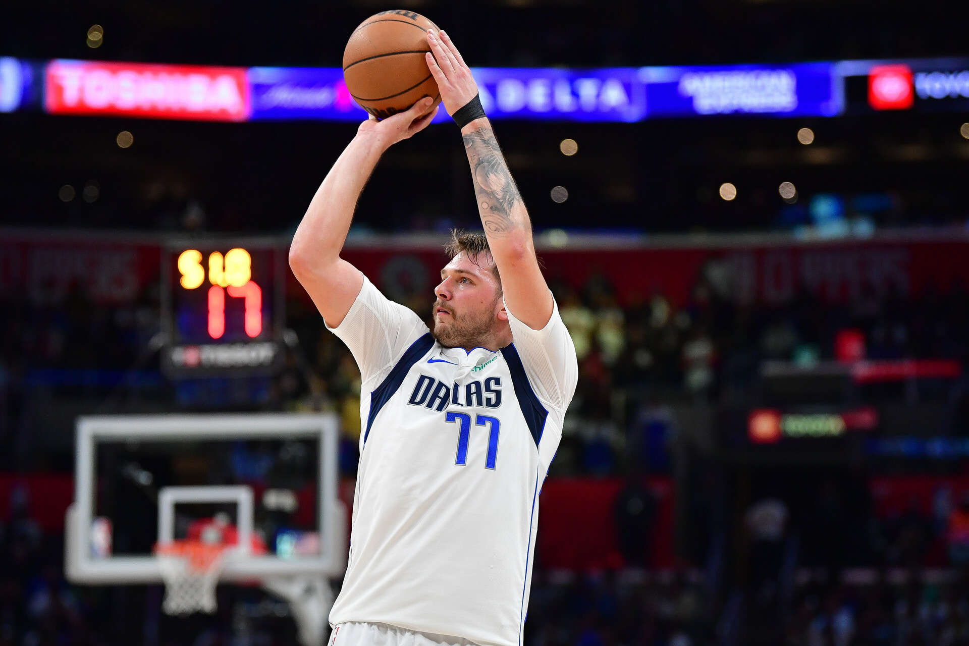 Nov 25, 2023; Los Angeles, California, USA; Dallas Mavericks guard Luka Doncic (77) shoots against the Los Angeles Clippers during the second half Crypto.com Arena.