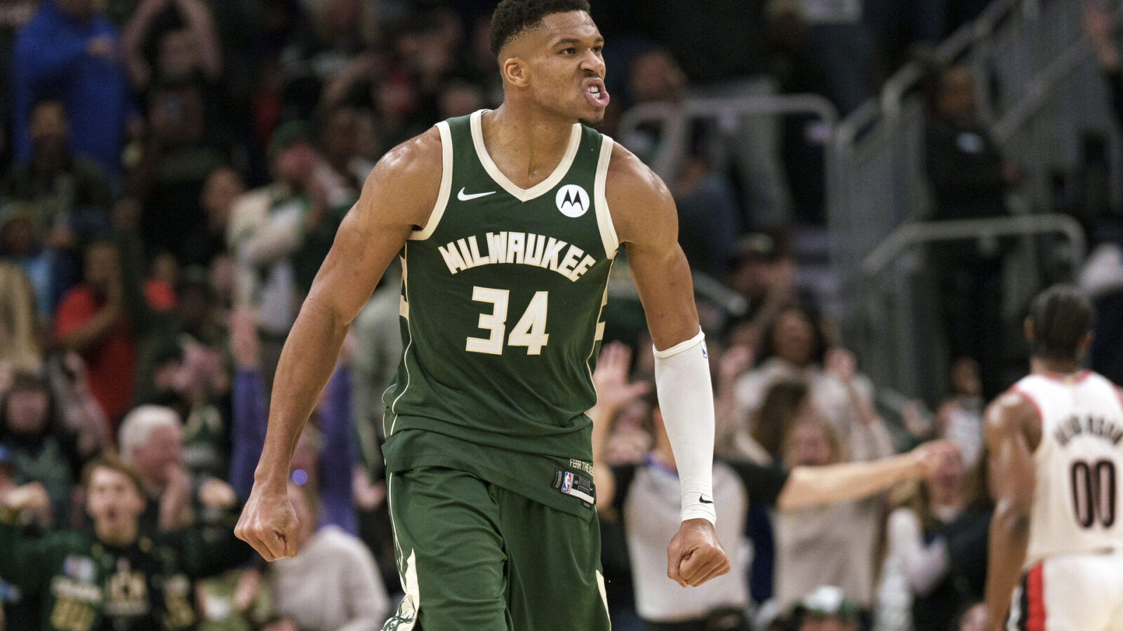 Nov 26, 2023; Milwaukee, Wisconsin, USA; Milwaukee Bucks forward Giannis Antetokounmpo (34) reacts after scoring a basket during the fourth quarter against the Portland Trail Blazers at Fiserv Forum.