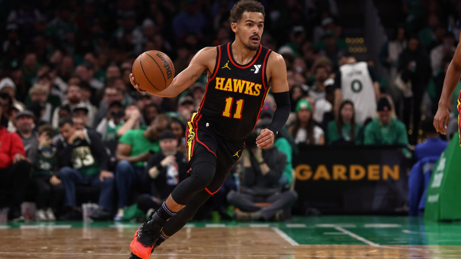 Nov 26, 2023; Boston, Massachusetts, USA; Atlanta Hawks guard Trae Young (11) brings the ball up the court against the Boston Celtics during the second quarter at TD Garden.