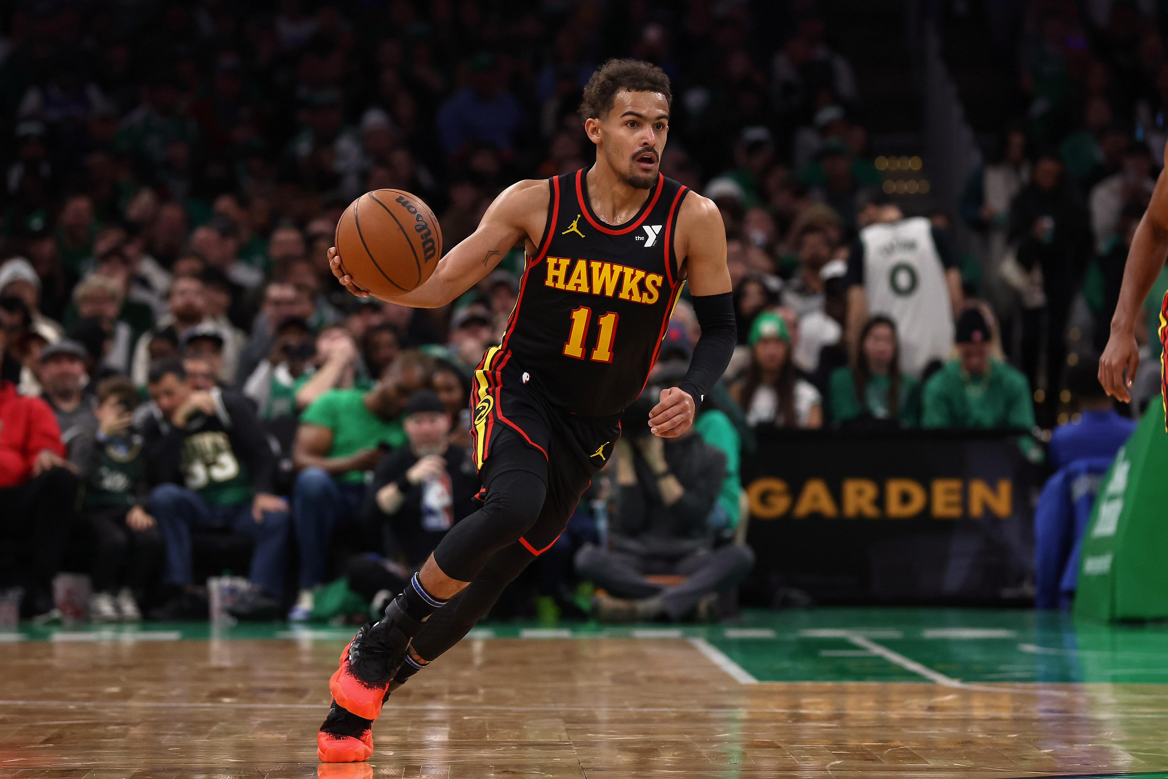 Nov 26, 2023; Boston, Massachusetts, USA; Atlanta Hawks guard Trae Young (11) brings the ball up the court against the Boston Celtics during the second quarter at TD Garden.