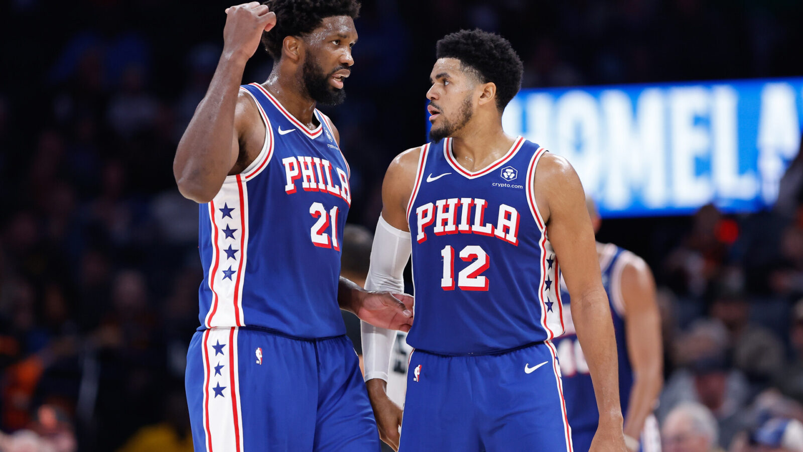 Nov 25, 2023; Oklahoma City, Oklahoma, USA; Philadelphia 76ers center Joel Embiid (21) and forward Tobias Harris (12) talk between plays against the Oklahoma City Thunder during the second half at Paycom Center.