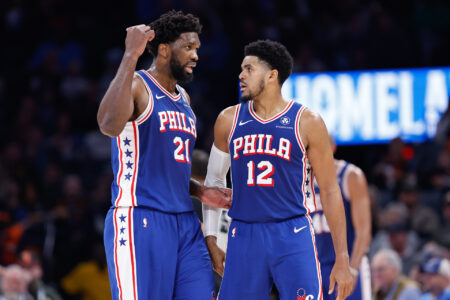 Nov 25, 2023; Oklahoma City, Oklahoma, USA; Philadelphia 76ers center Joel Embiid (21) and forward Tobias Harris (12) talk between plays against the Oklahoma City Thunder during the second half at Paycom Center.