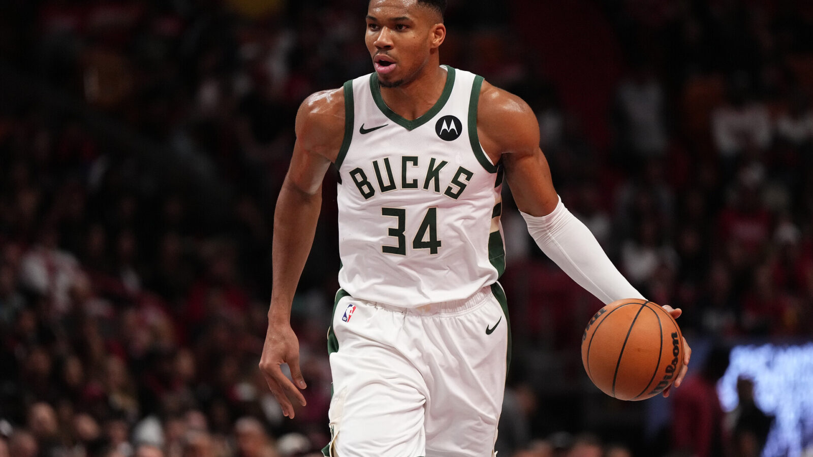 Nov 28, 2023; Miami, Florida, USA; Milwaukee Bucks forward Giannis Antetokounmpo (34) dribbles the ball up the court against the Miami Heat during the second half at Kaseya Center.