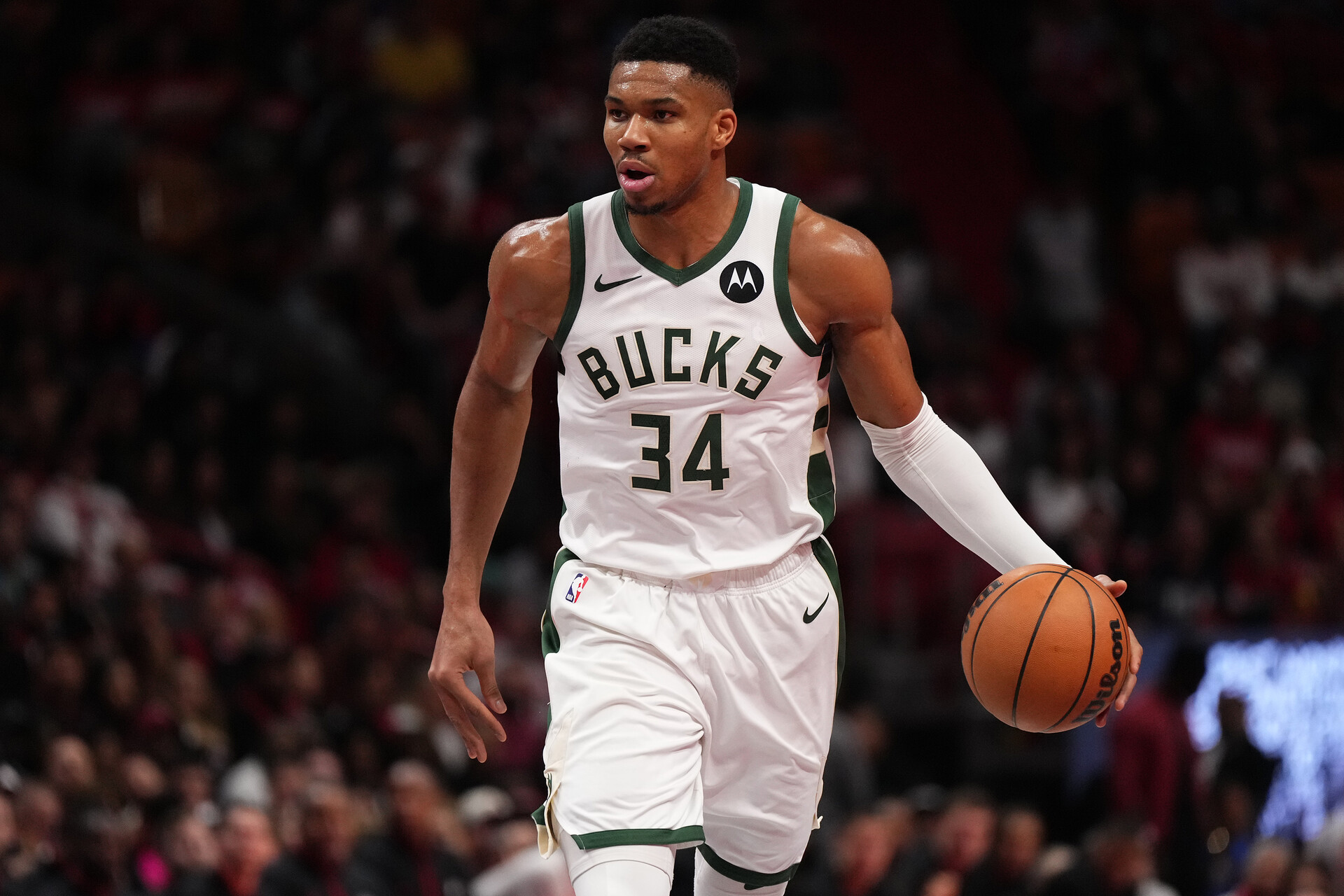 Nov 28, 2023; Miami, Florida, USA; Milwaukee Bucks forward Giannis Antetokounmpo (34) dribbles the ball up the court against the Miami Heat during the second half at Kaseya Center.