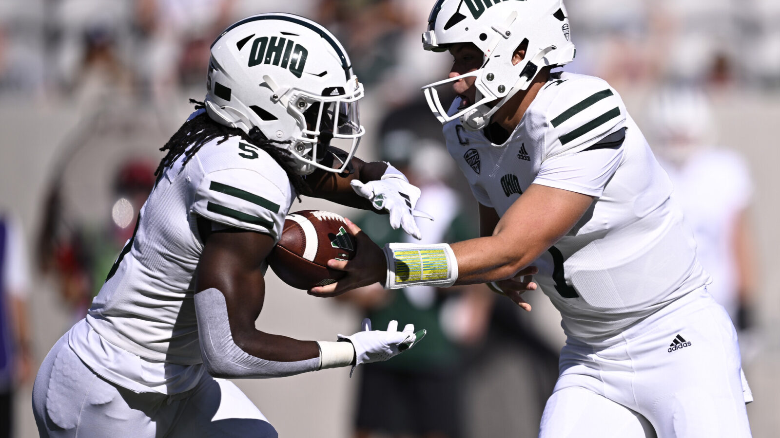 Ohio Bobcats quarterback Kurtis Rourke (7) hands off to running back Sieh Bangura (5) during the first half against the San Diego State Aztecs at Snapdragon Stadium.