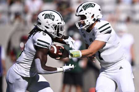Ohio Bobcats quarterback Kurtis Rourke (7) hands off to running back Sieh Bangura (5) during the first half against the San Diego State Aztecs at Snapdragon Stadium.