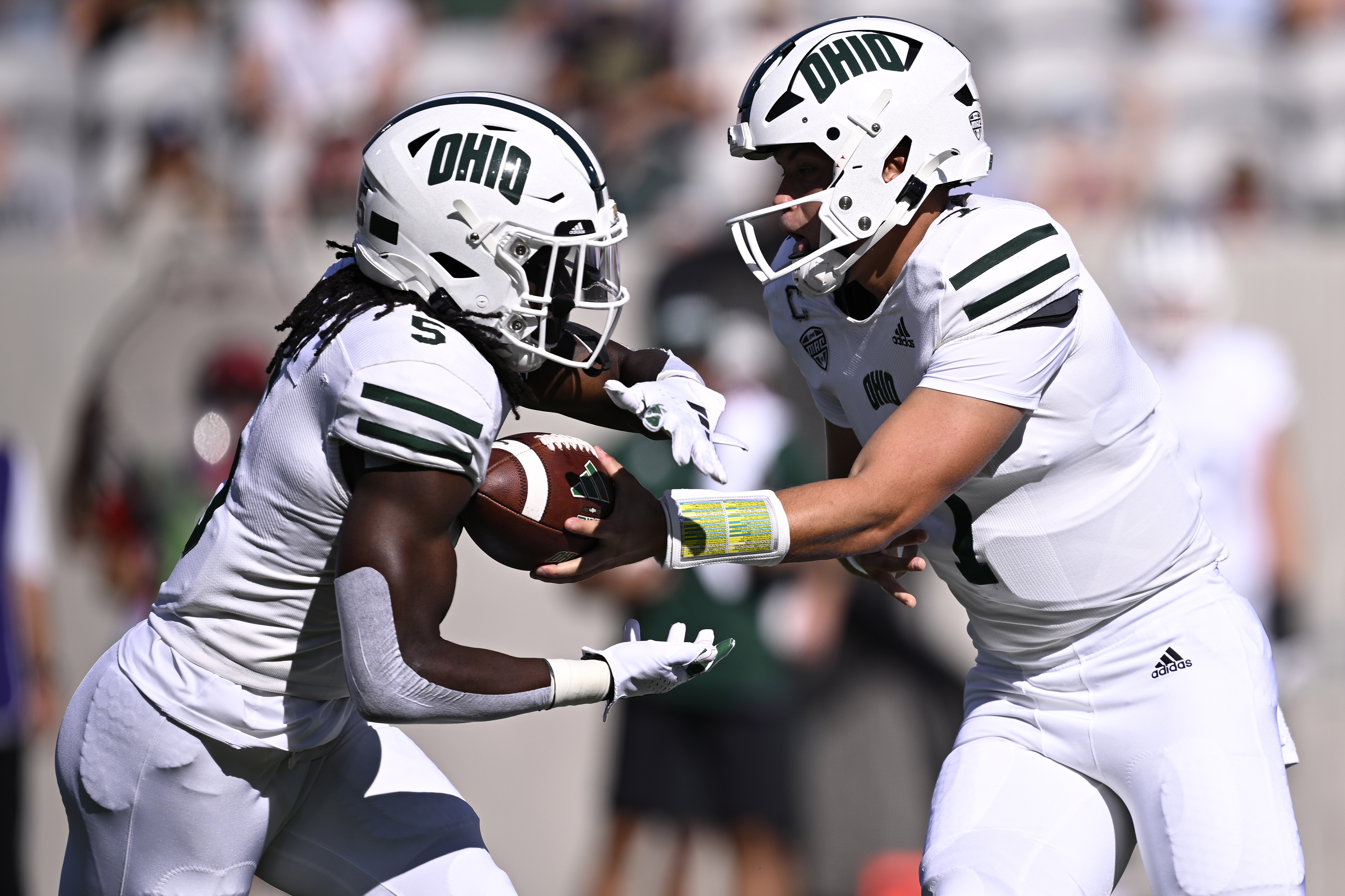 Ohio Bobcats quarterback Kurtis Rourke (7) hands off to running back Sieh Bangura (5) during the first half against the San Diego State Aztecs at Snapdragon Stadium.