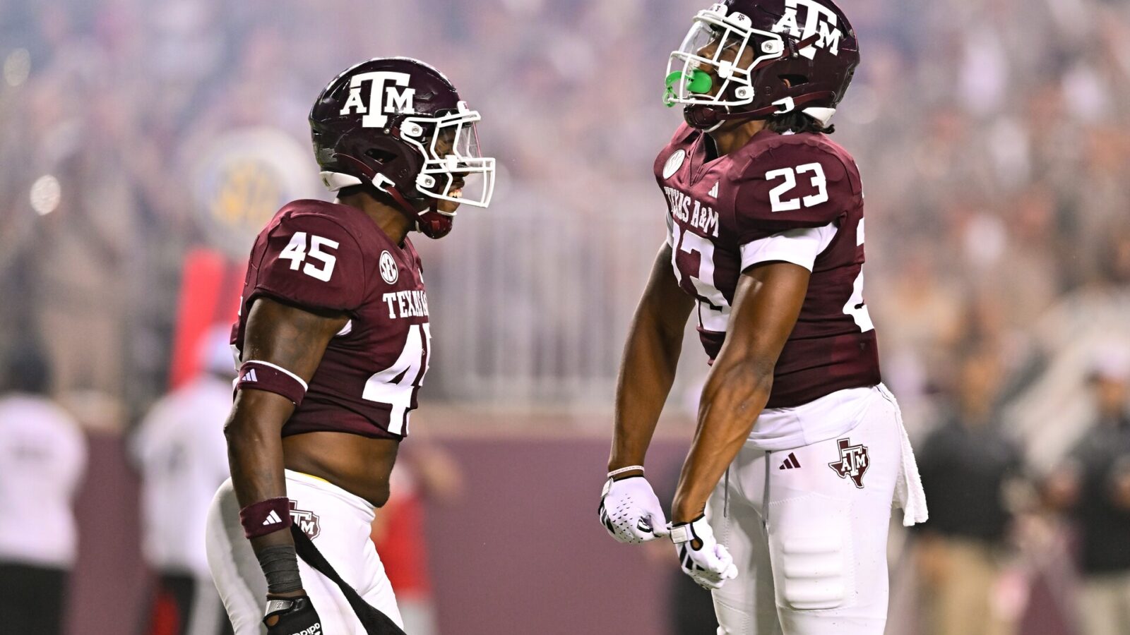 Sep 2, 2023; College Station, Texas, USA; Texas A&M Aggies linebacker Chantz Johnson (23) and linebacker Edgerrin Cooper (45) react to a play during the third quarter against New Mexico Lobos at Kyle Field.