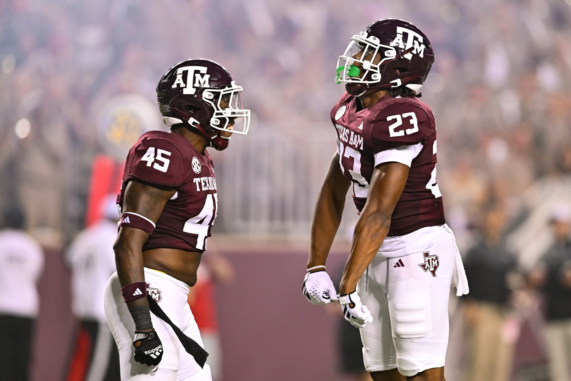 Sep 2, 2023; College Station, Texas, USA; Texas A&M Aggies linebacker Chantz Johnson (23) and linebacker Edgerrin Cooper (45) react to a play during the third quarter against New Mexico Lobos at Kyle Field.