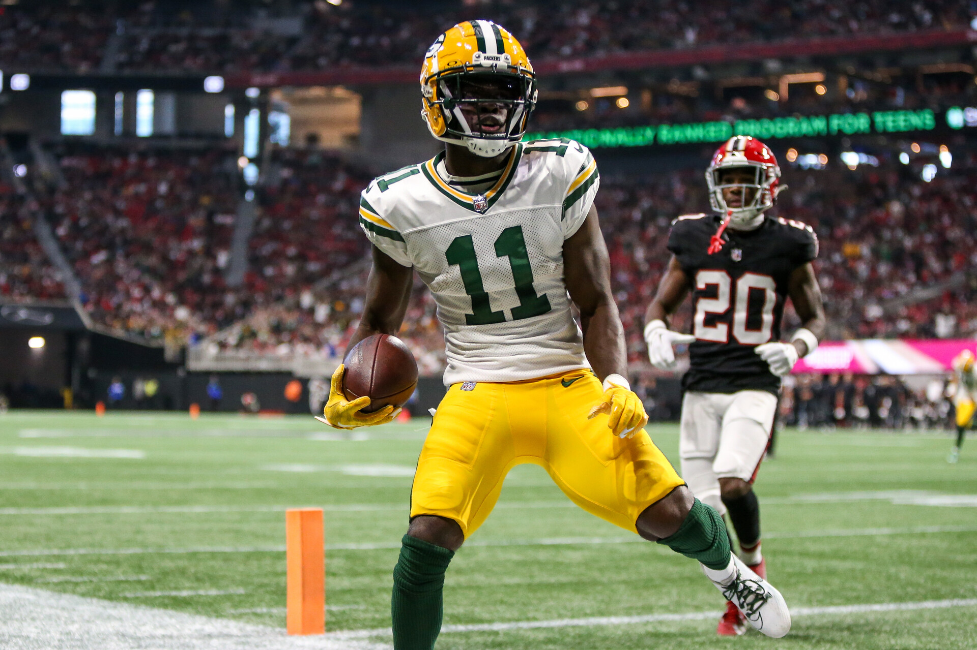 Sep 17, 2023; Atlanta, Georgia, USA; Green Bay Packers wide receiver Jayden Reed (11) scores a touchdown against the Atlanta Falcons in the second half at Mercedes-Benz Stadium.