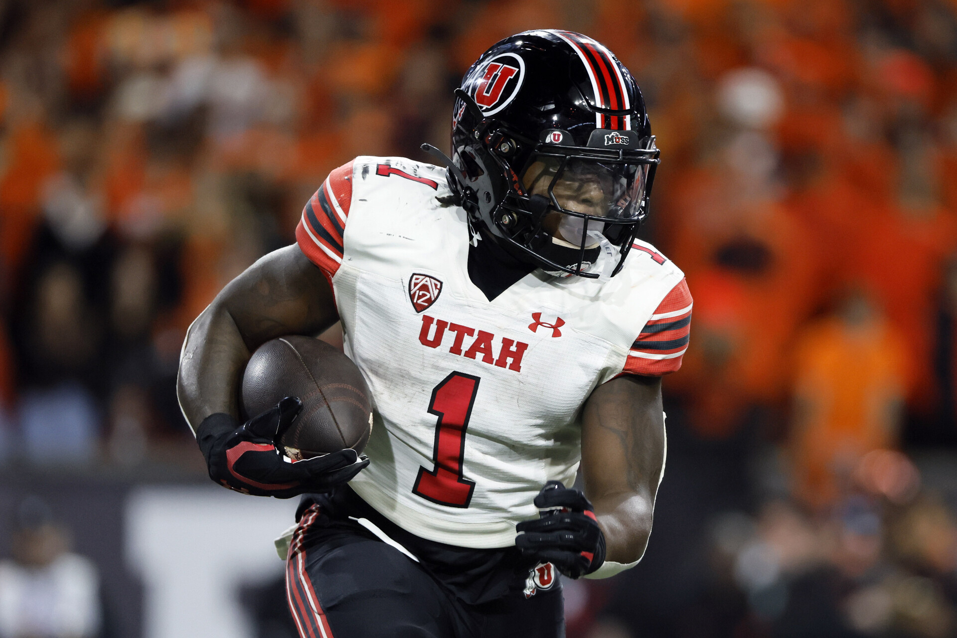 Utah Utes running back Jaylon Glover (1) runs the ball during the second half against the Oregon State Beavers at Reser Stadium.