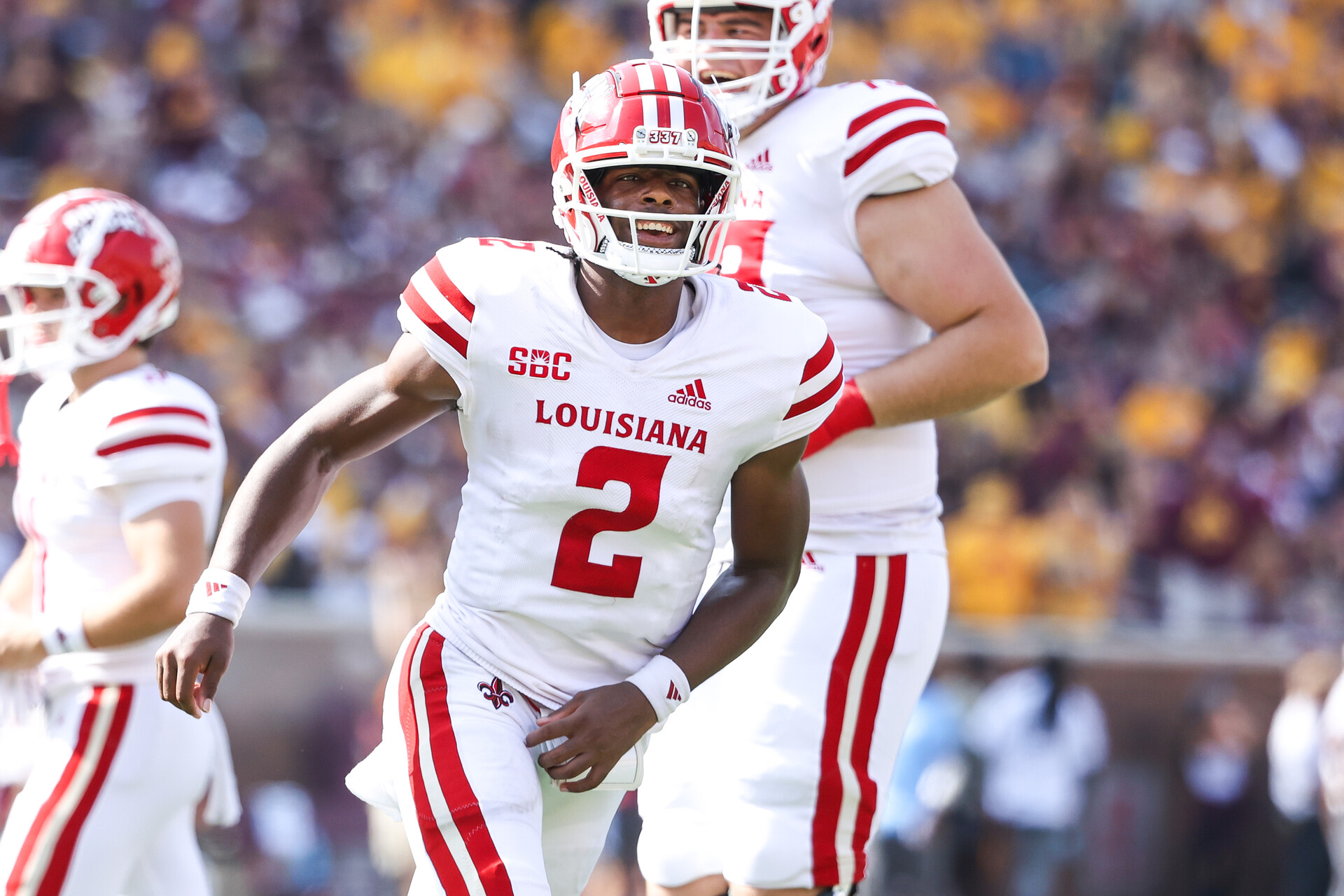 Louisiana-Lafayette Ragin Cajuns quarterback Zeon Chriss (2) celebrates a touchdown by wide receiver Robert Williams (not shown) during the second quarter against the Minnesota Golden Gophers at Huntington Bank Stadium.