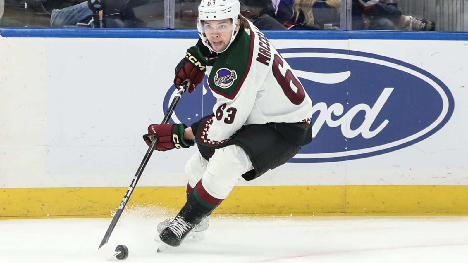 Oct 17, 2023; Elmont, New York, USA; Arizona Coyotes left wing Matias Maccelli (63) attempts a shot on goal in the first period against the New York Islanders at UBS Arena.