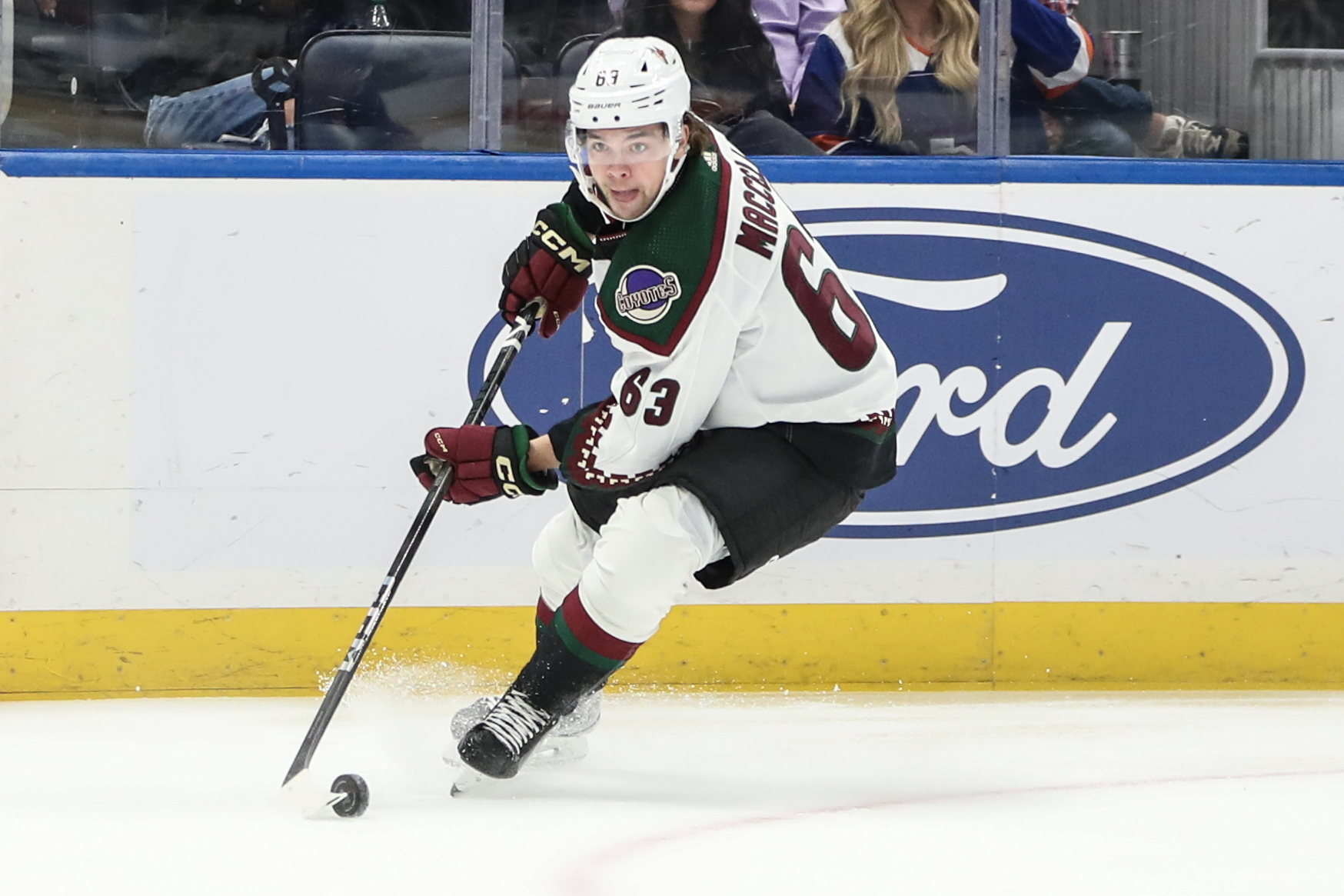 Oct 17, 2023; Elmont, New York, USA; Arizona Coyotes left wing Matias Maccelli (63) attempts a shot on goal in the first period against the New York Islanders at UBS Arena.