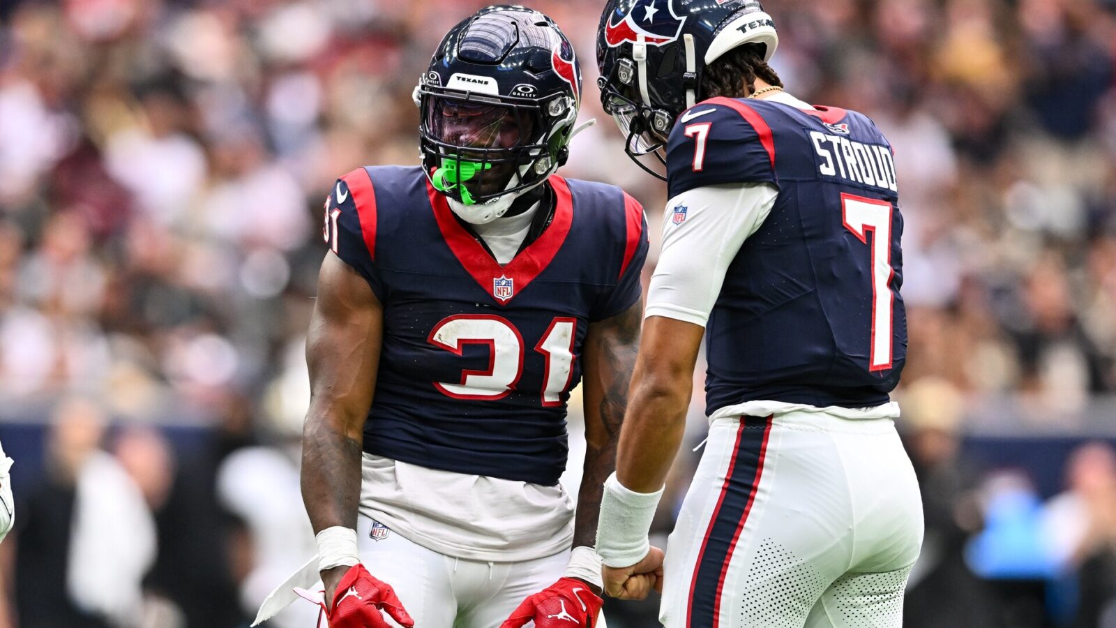 Oct 15, 2023; Houston, Texas, USA; Houston Texans running back Dameon Pierce (31) and quarterback C.J. Stroud (7) react during the first quarter against the New Orleans Saints at NRG Stadium.