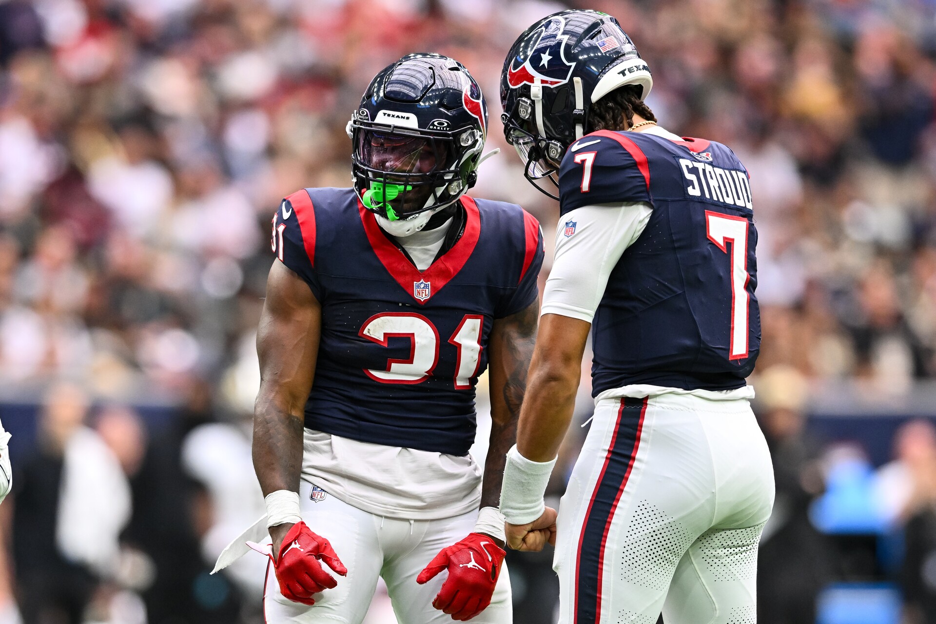 Oct 15, 2023; Houston, Texas, USA; Houston Texans running back Dameon Pierce (31) and quarterback C.J. Stroud (7) react during the first quarter against the New Orleans Saints at NRG Stadium.
