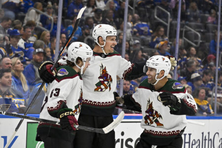 Oct 19, 2023; St. Louis, Missouri, USA; Arizona Coyotes center Nick Bjugstad (17) celebrates with left wing Matias Maccelli (63) and left wing Jason Zucker (16) after scoring against the St. Louis Blues during the first period at Enterprise Center.