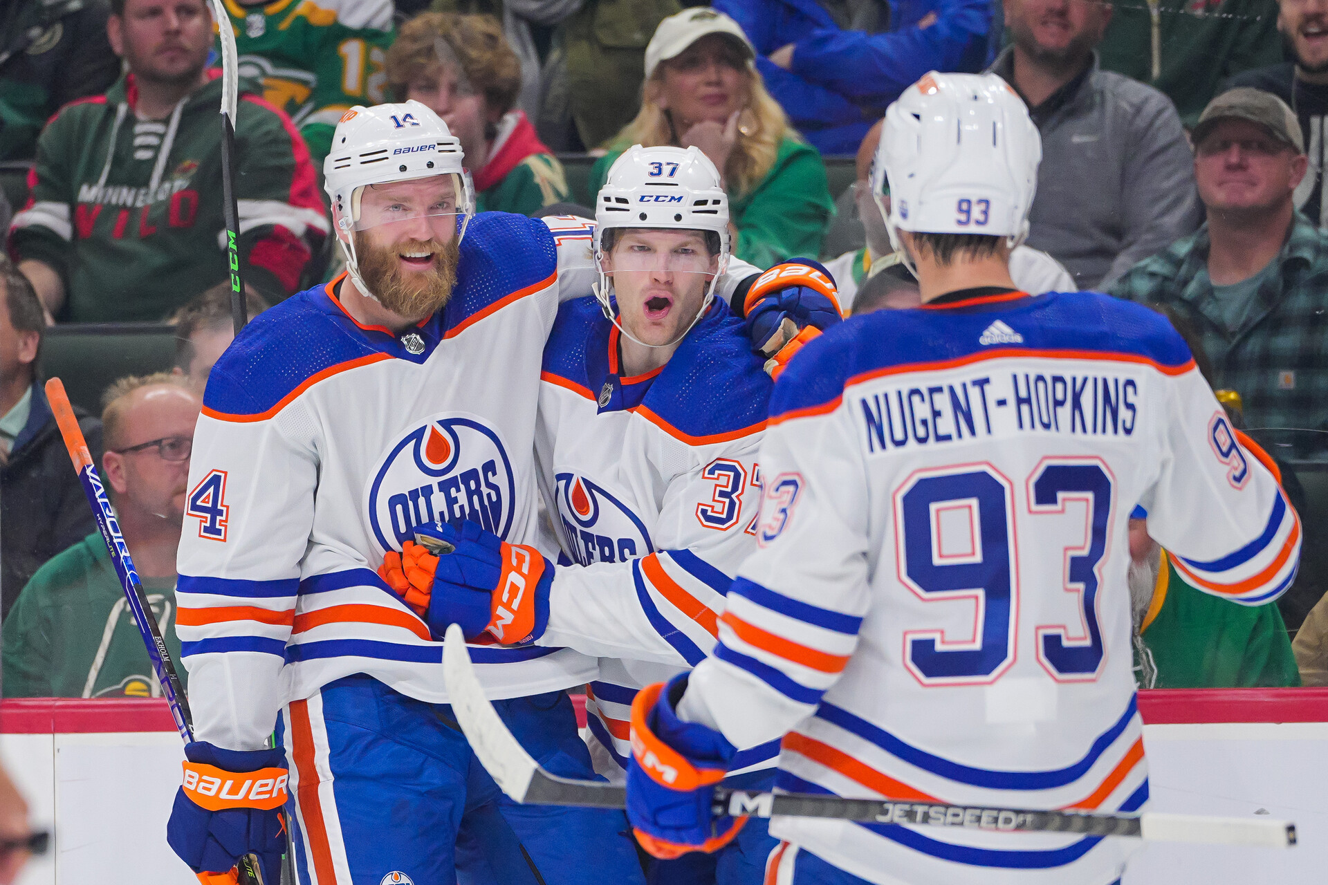 Oct 24, 2023; Saint Paul, Minnesota, USA; Edmonton Oilers left wing Warren Foegele (37) celebrates his goal with defenseman Mattias Ekholm (14) against the Minnesota Wild in the first period at Xcel Energy Center.