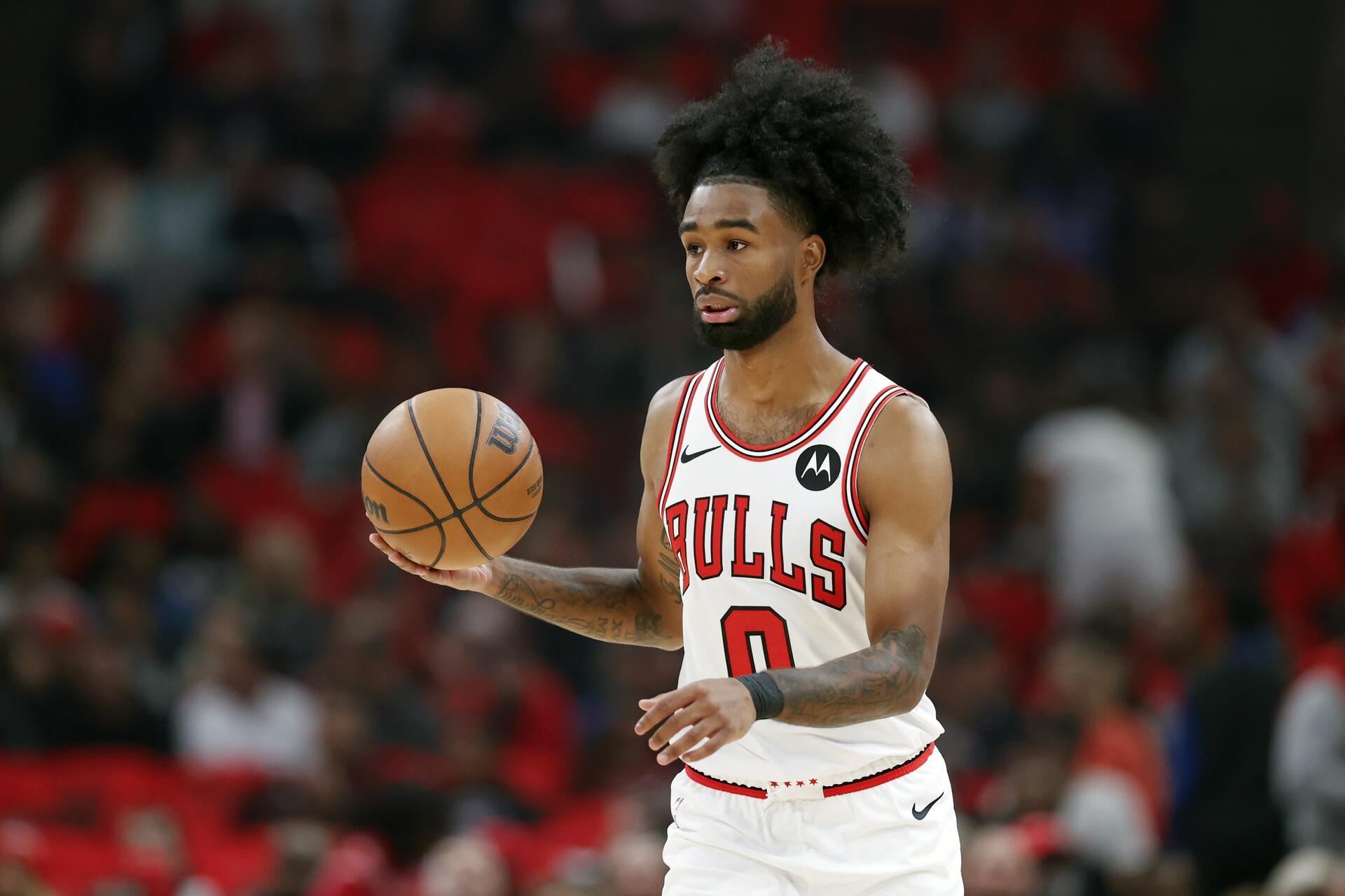 Chicago Bulls guard Coby White (0) brings the ball up court against the Oklahoma City Thunder during the first half of a basketball game at United Center.