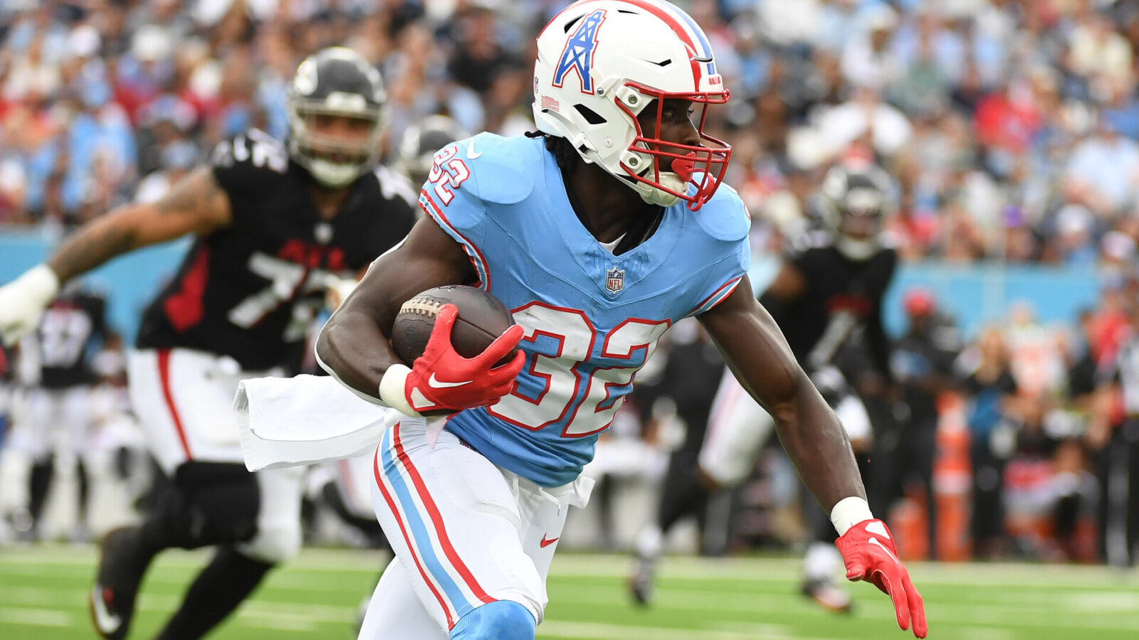 Oct 29, 2023; Nashville, Tennessee, USA; Tennessee Titans running back Tyjae Spears (32) runs after the catch during the first half against the Atlanta Falcons at Nissan Stadium.