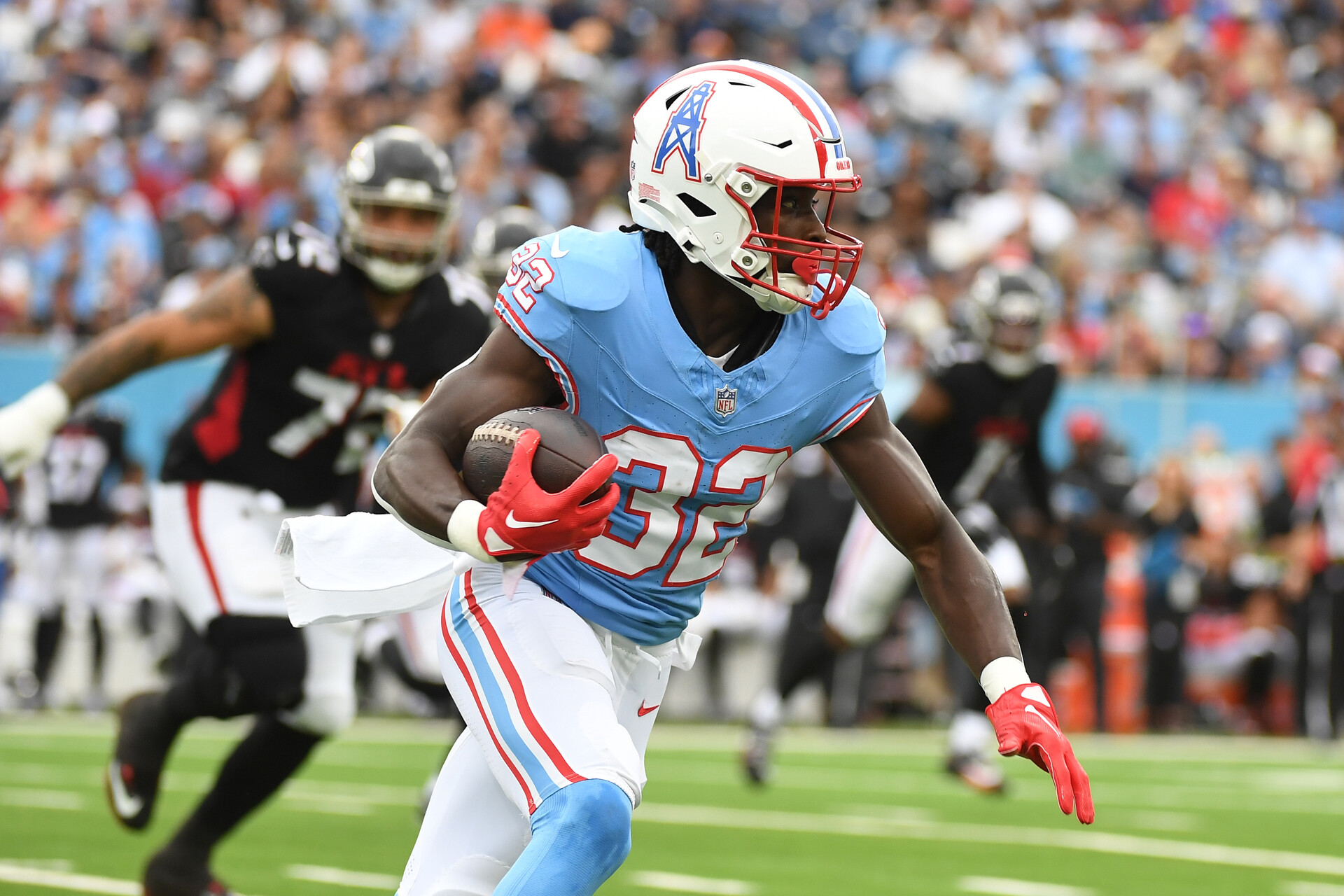 Oct 29, 2023; Nashville, Tennessee, USA; Tennessee Titans running back Tyjae Spears (32) runs after the catch during the first half against the Atlanta Falcons at Nissan Stadium.