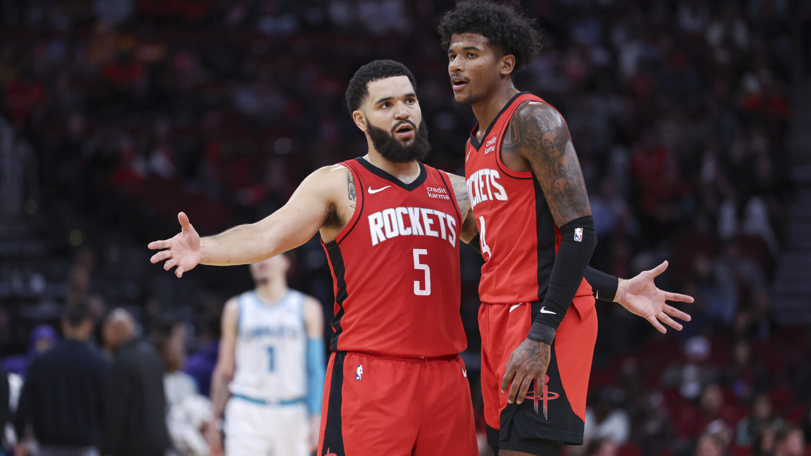 Houston Rockets guard Fred VanVleet (5) reacts with guard Jalen Green (4) during the fourth quarter against the Charlotte Hornets at Toyota Center.