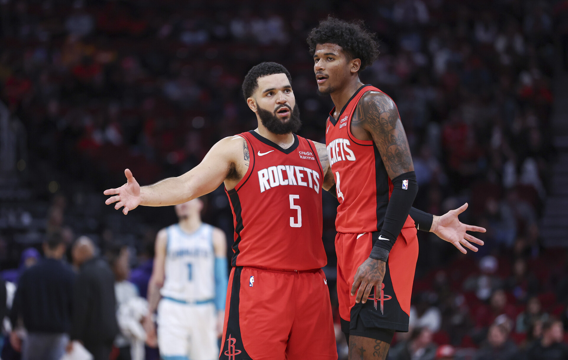 Houston Rockets guard Fred VanVleet (5) reacts with guard Jalen Green (4) during the fourth quarter against the Charlotte Hornets at Toyota Center.