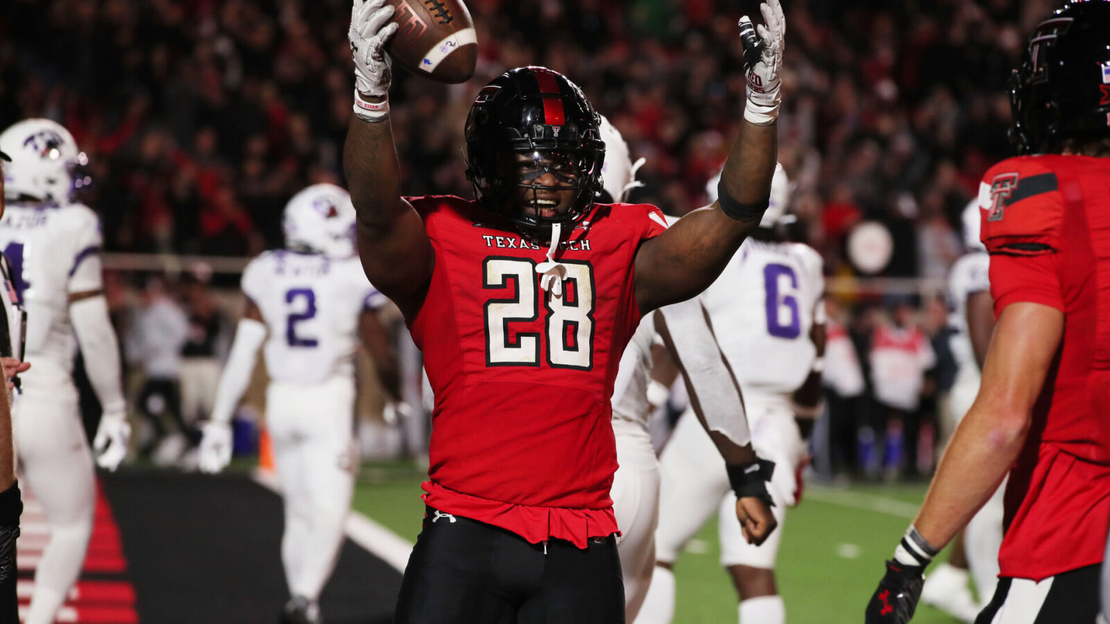 Nov 2, 2023; Lubbock, Texas, USA; Texas Tech Red Raiders running back Tahj Brooks (28) reacts after scoring a touchdown against the Texas Christian Horned Frogs in the second half at Jones AT&T Stadium and Cody Campbell Field.