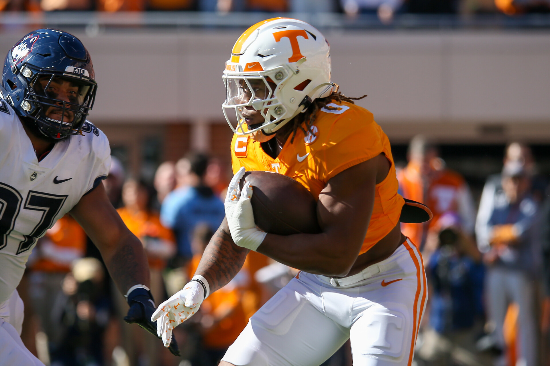 Tennessee Volunteers running back Jaylen Wright (0) runs the ball against the Connecticut Huskies during the first half at Neyland Stadium.