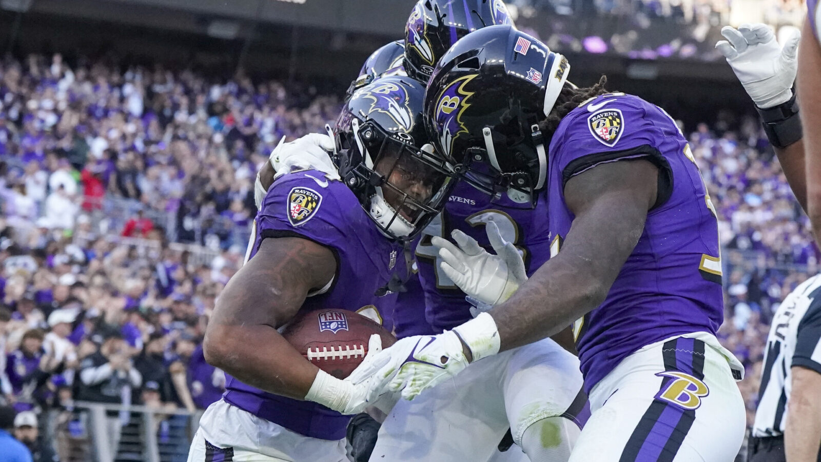 Nov 5, 2023; Baltimore, Maryland, USA; Baltimore Ravens running back Keaton Mitchell (34) celebrates his touchdown against the Seattle Seahawks with running back Justice Hill (43) and running back Gus Edwards (35) during the third quarter at M&T Bank Stadium