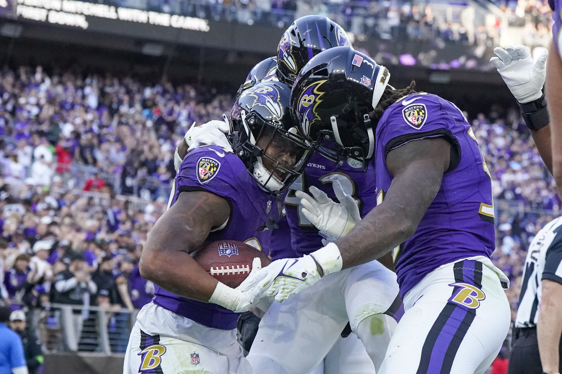 Nov 5, 2023; Baltimore, Maryland, USA; Baltimore Ravens running back Keaton Mitchell (34) celebrates his touchdown against the Seattle Seahawks with running back Justice Hill (43) and running back Gus Edwards (35) during the third quarter at M&T Bank Stadium
