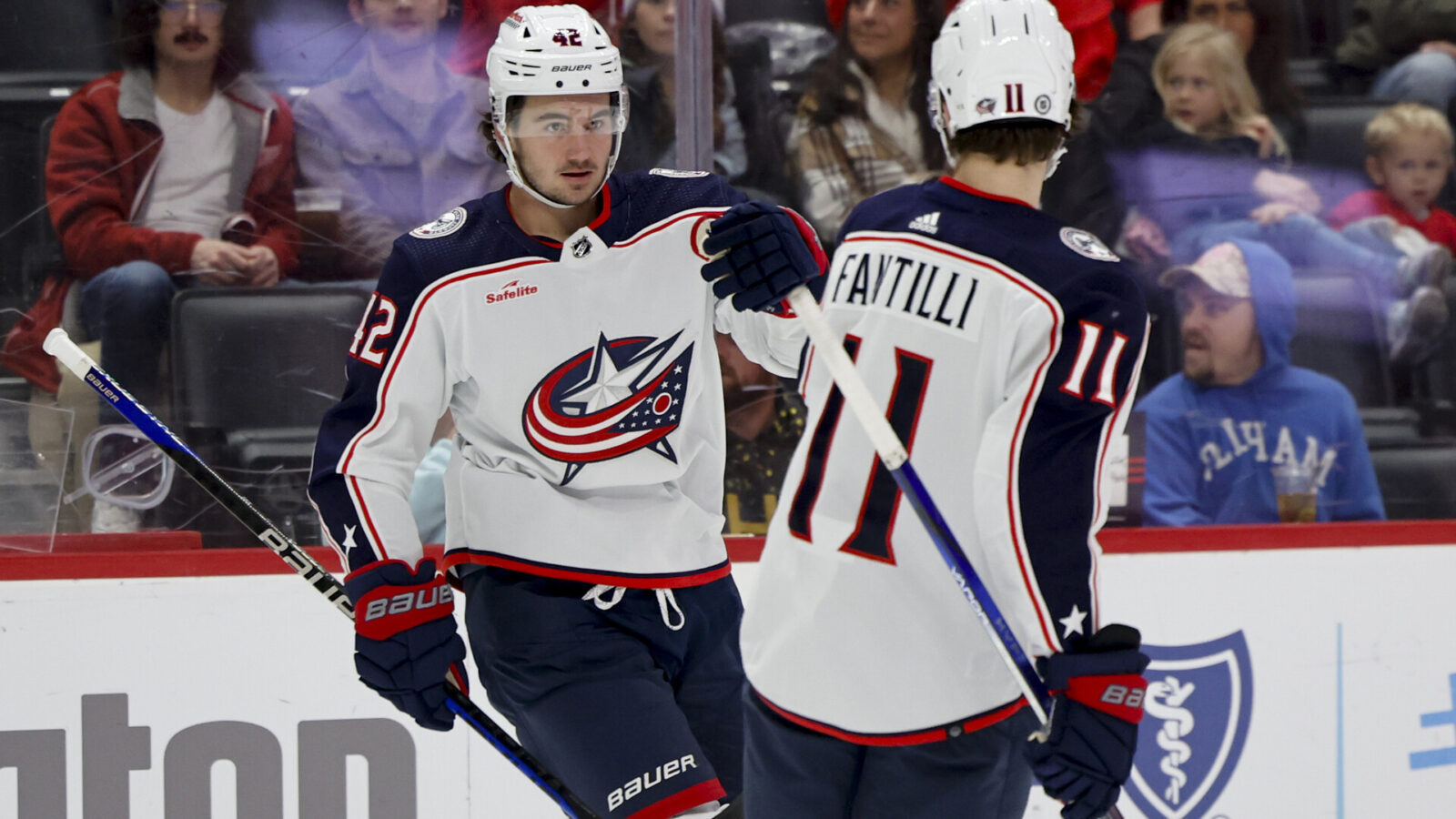 Nov 11, 2023; Detroit, Michigan, USA; Columbus Blue Jackets center Alexandre Texier (42) celebrates with center Adam Fantilli (11) after scoring against the Detroit Red Wings in the first period at Little Caesars Arena.