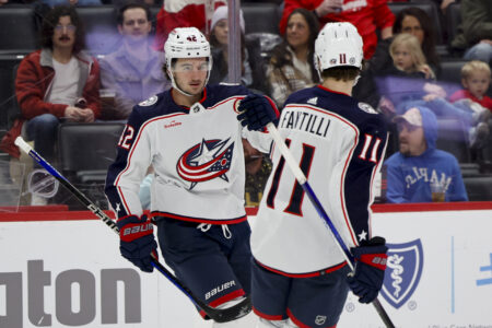 Nov 11, 2023; Detroit, Michigan, USA; Columbus Blue Jackets center Alexandre Texier (42) celebrates with center Adam Fantilli (11) after scoring against the Detroit Red Wings in the first period at Little Caesars Arena.