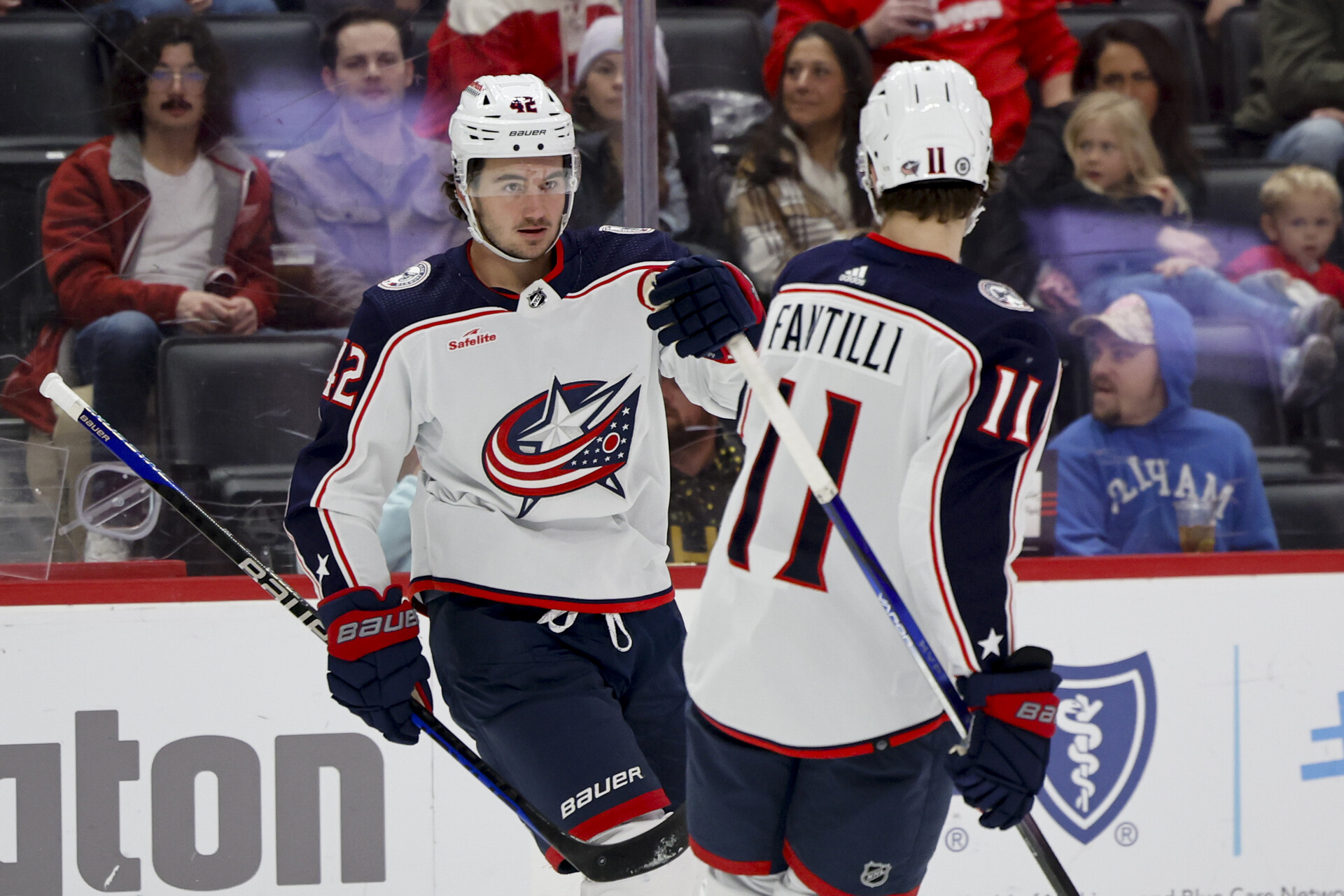 Nov 11, 2023; Detroit, Michigan, USA; Columbus Blue Jackets center Alexandre Texier (42) celebrates with center Adam Fantilli (11) after scoring against the Detroit Red Wings in the first period at Little Caesars Arena.