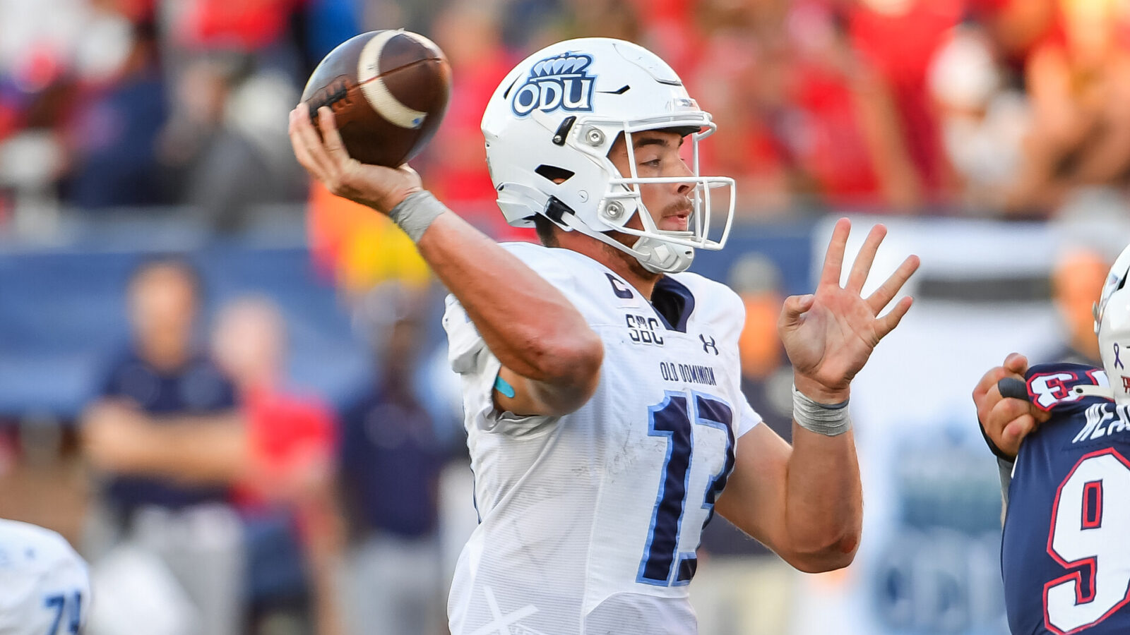 Old Dominion Monarchs quarterback Grant Wilson (13) throws a pass in the forth quarter at Williams Stadium.