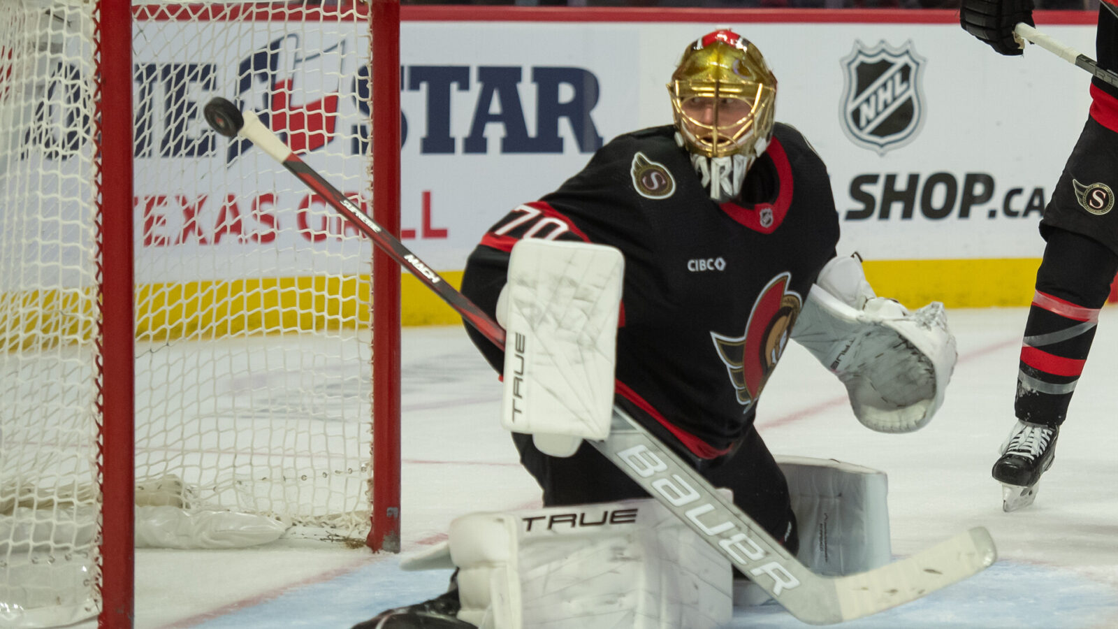 Nov 11, 2023; Ottawa, Ontario, CAN; Ottawa Senators goalie Joonas Korpisalo (70) makes a save in the second period against the Calgary Flames at the Canadian Tire Centre.
