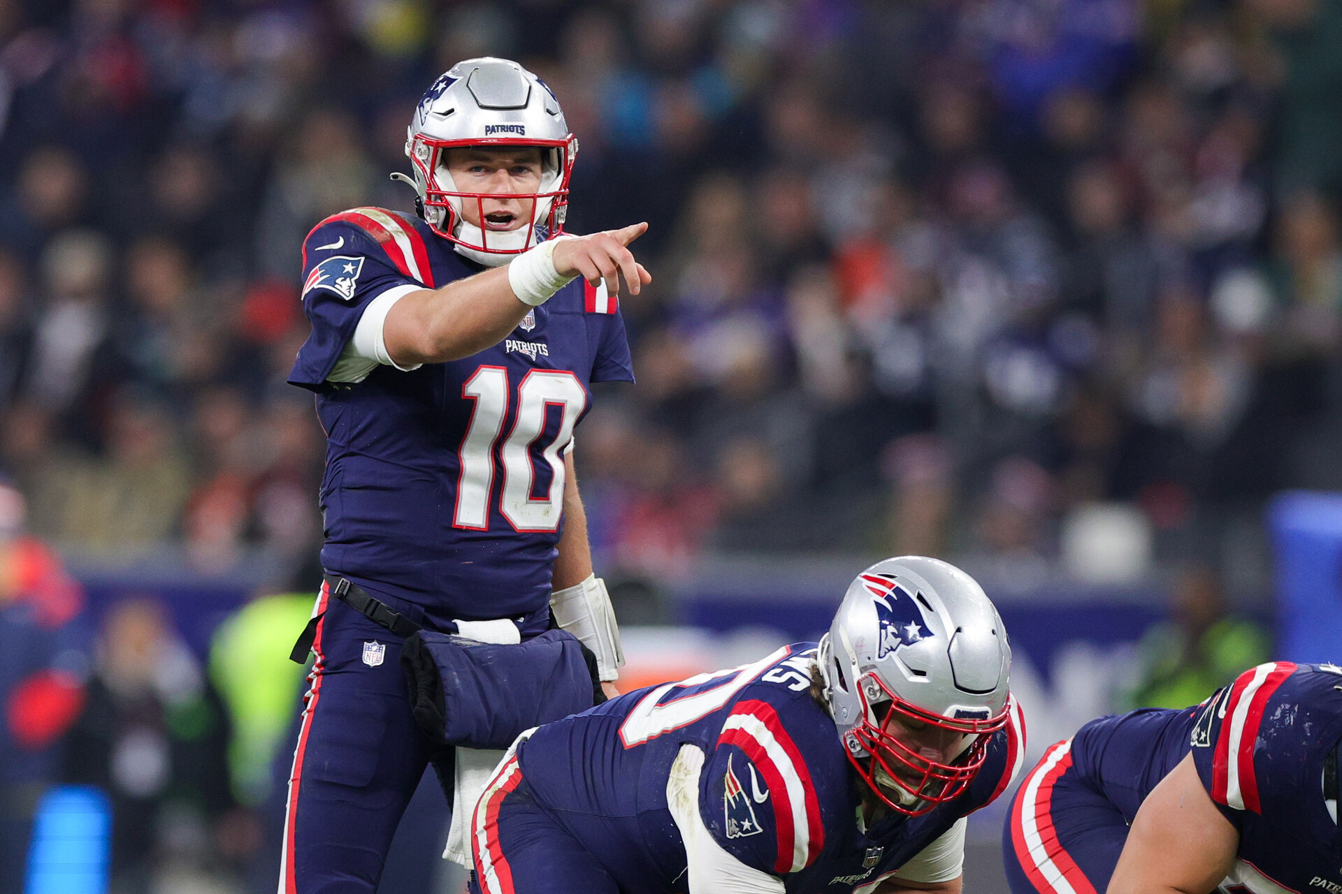 Nov 12, 2023; Frankfurt, Germany; New England Patriots quarterback Mac Jones (10) calls a play at the line against the Indianapolis Colts in the fourth quarter during an International Series game at Deutsche Bank Park.
