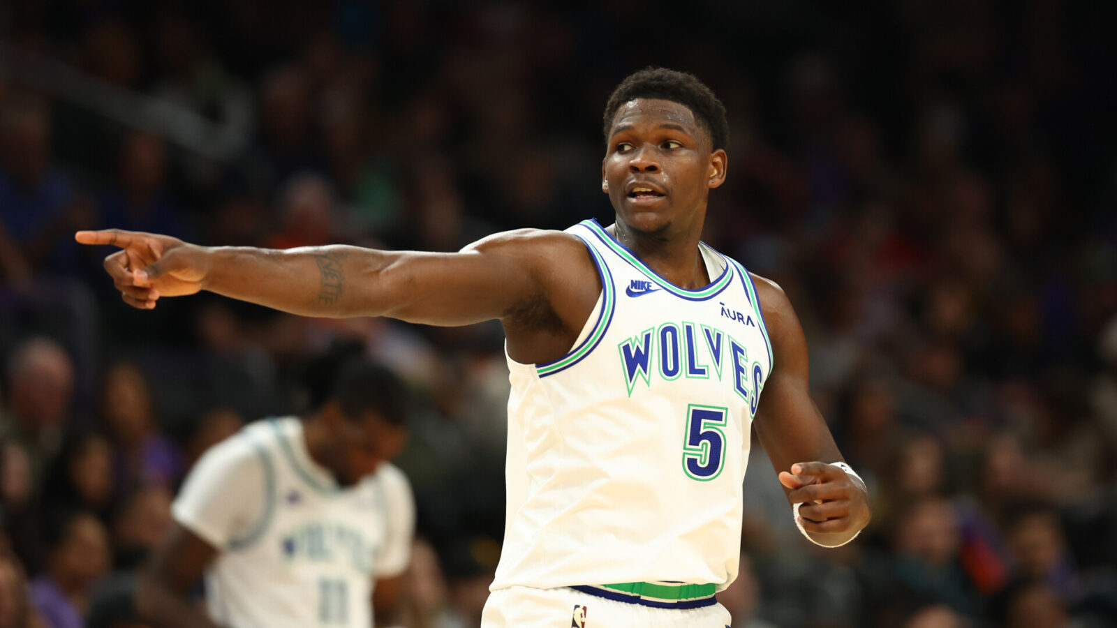 Nov 15, 2023; Phoenix, Arizona, USA; Minnesota Timberwolves guard Anthony Edwards (5) reacts against the Phoenix Suns in the first half at Footprint Center.