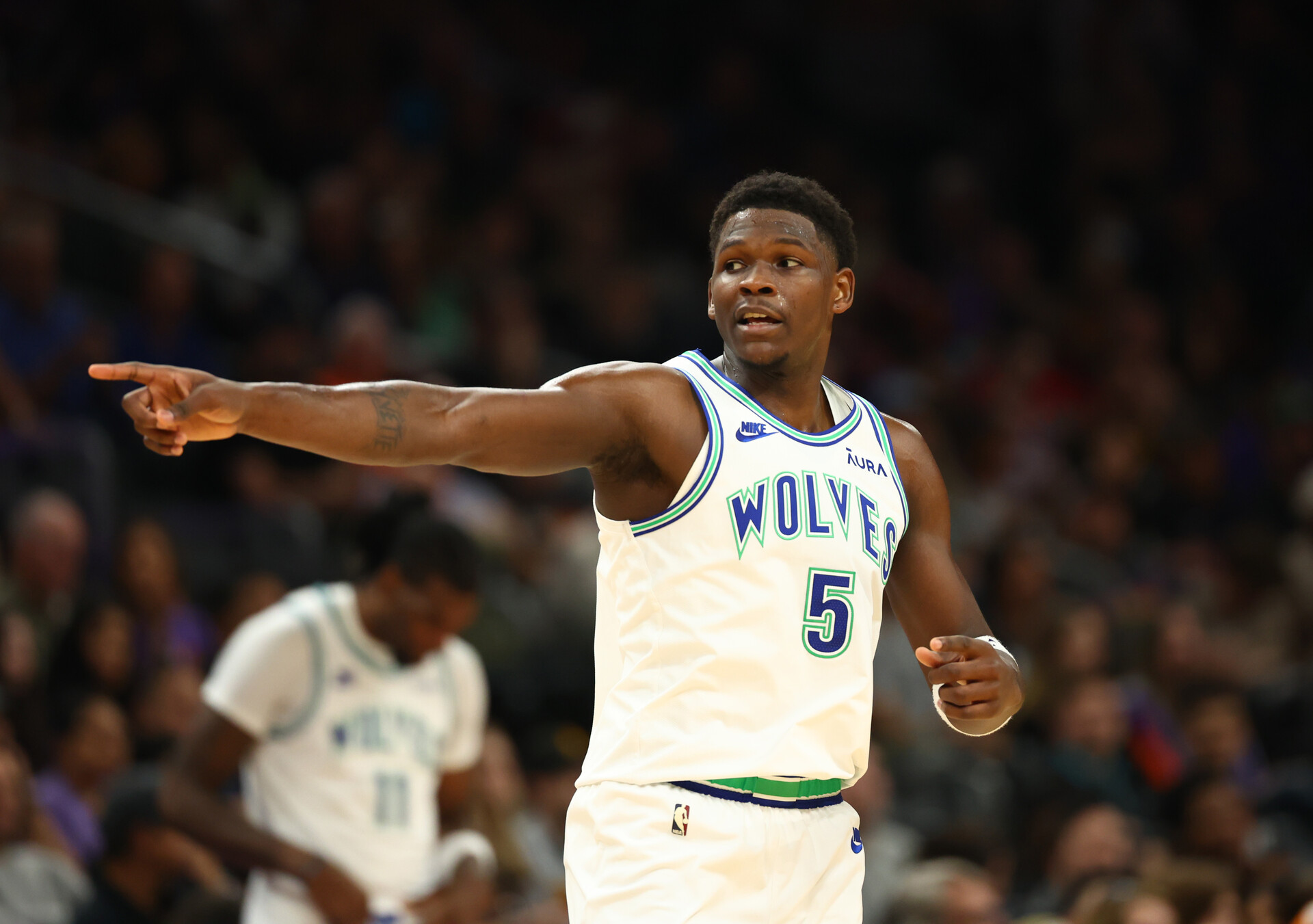 Nov 15, 2023; Phoenix, Arizona, USA; Minnesota Timberwolves guard Anthony Edwards (5) reacts against the Phoenix Suns in the first half at Footprint Center.