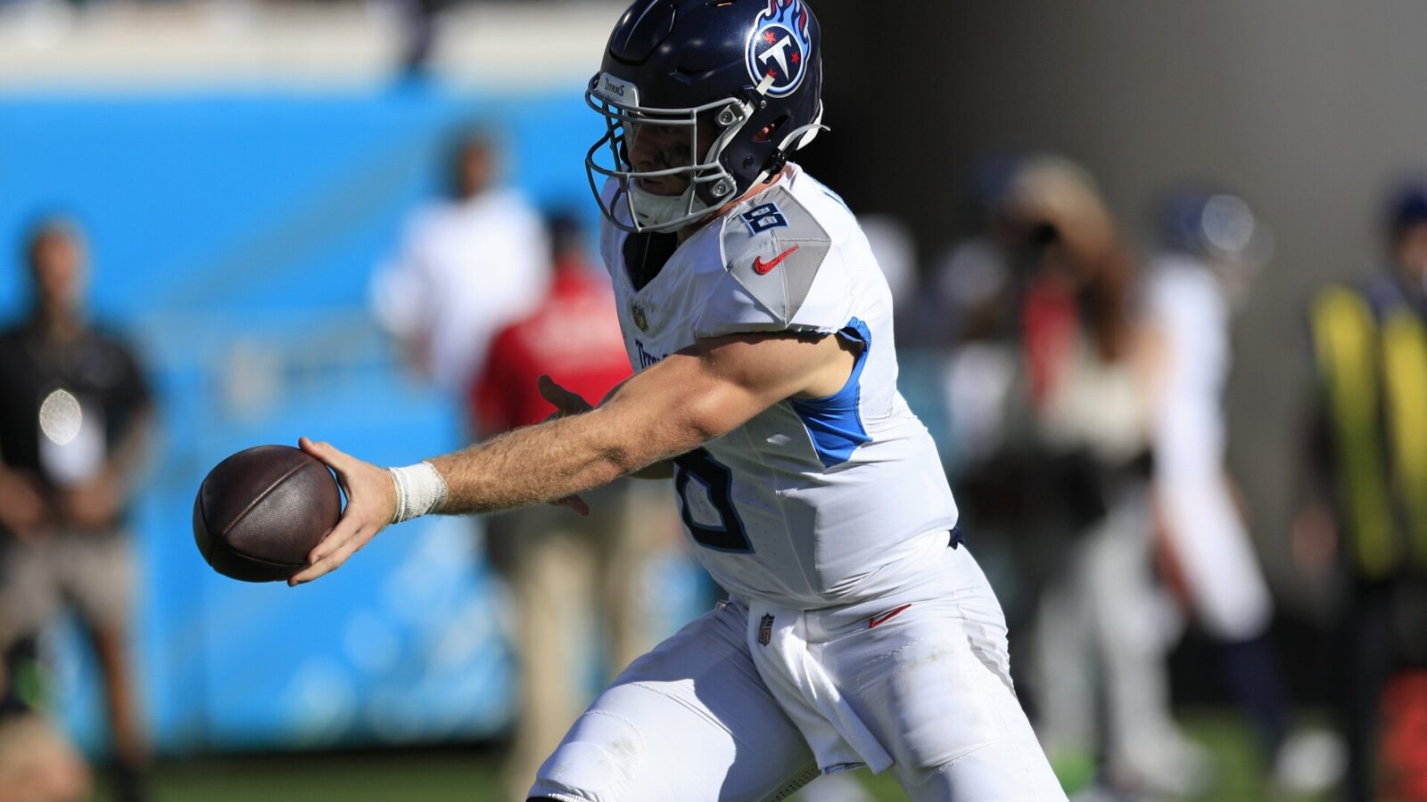 Tennessee Titans quarterback Will Levis (8) hands off during the third quarter an NFL football matchup Sunday, Nov. 19, 2023 at EverBank Stadium in Jacksonville, Fla. The Jacksonville Jaguars defeated the Tennessee Titans 34-14.