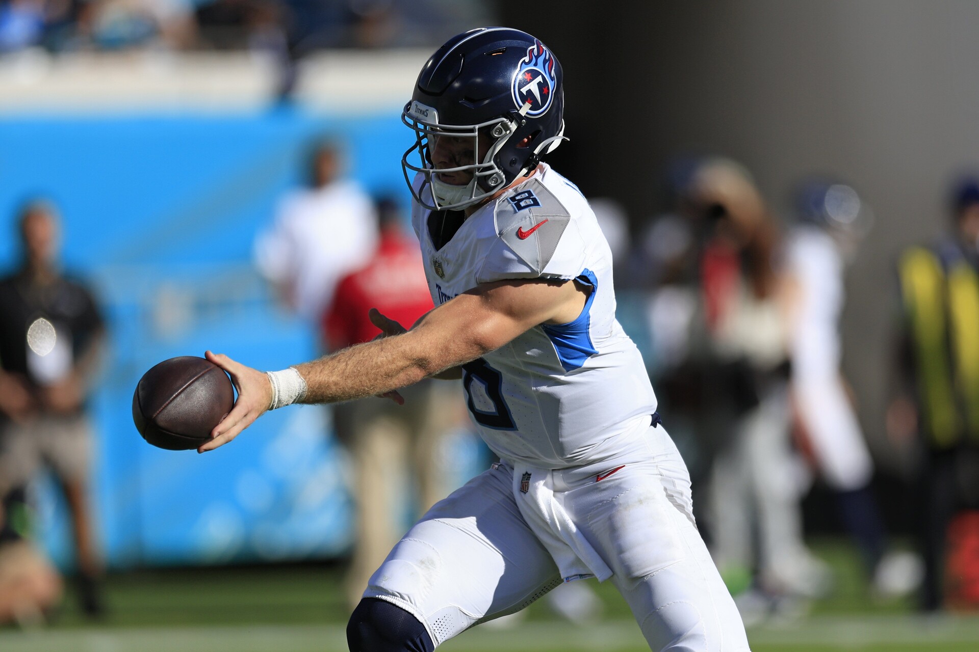 Tennessee Titans quarterback Will Levis (8) hands off during the third quarter an NFL football matchup Sunday, Nov. 19, 2023 at EverBank Stadium in Jacksonville, Fla. The Jacksonville Jaguars defeated the Tennessee Titans 34-14.