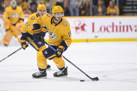 Nov 22, 2023; Nashville, Tennessee, USA; Nashville Predators left wing Gustav Nyquist (14) skates against the Calgary Flames during the first period at Bridgestone Arena.