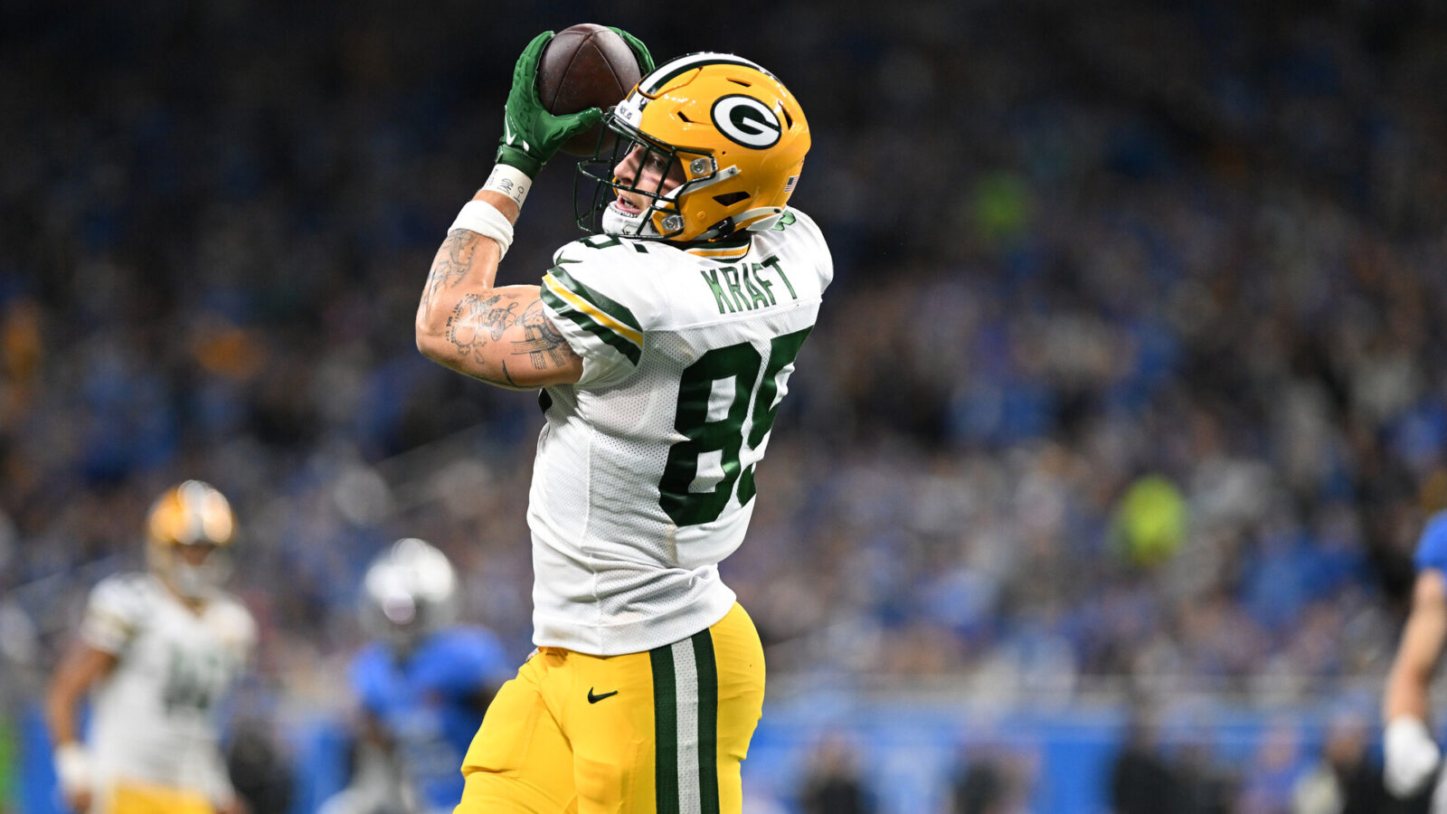 Nov 23, 2023; Detroit, Michigan, USA; Green Bay Packers tight end Tucker Kraft (85) catches a touchdown pass from quarterback Jordan Love (10) (not pictured) against the Detroit Lions in the first quarter at Ford Field.