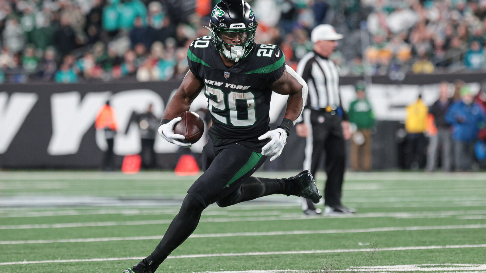 Nov 24, 2023; East Rutherford, New Jersey, USA; New York Jets running back Breece Hall (20) carries the ball during the second half against the Miami Dolphins at MetLife Stadium.