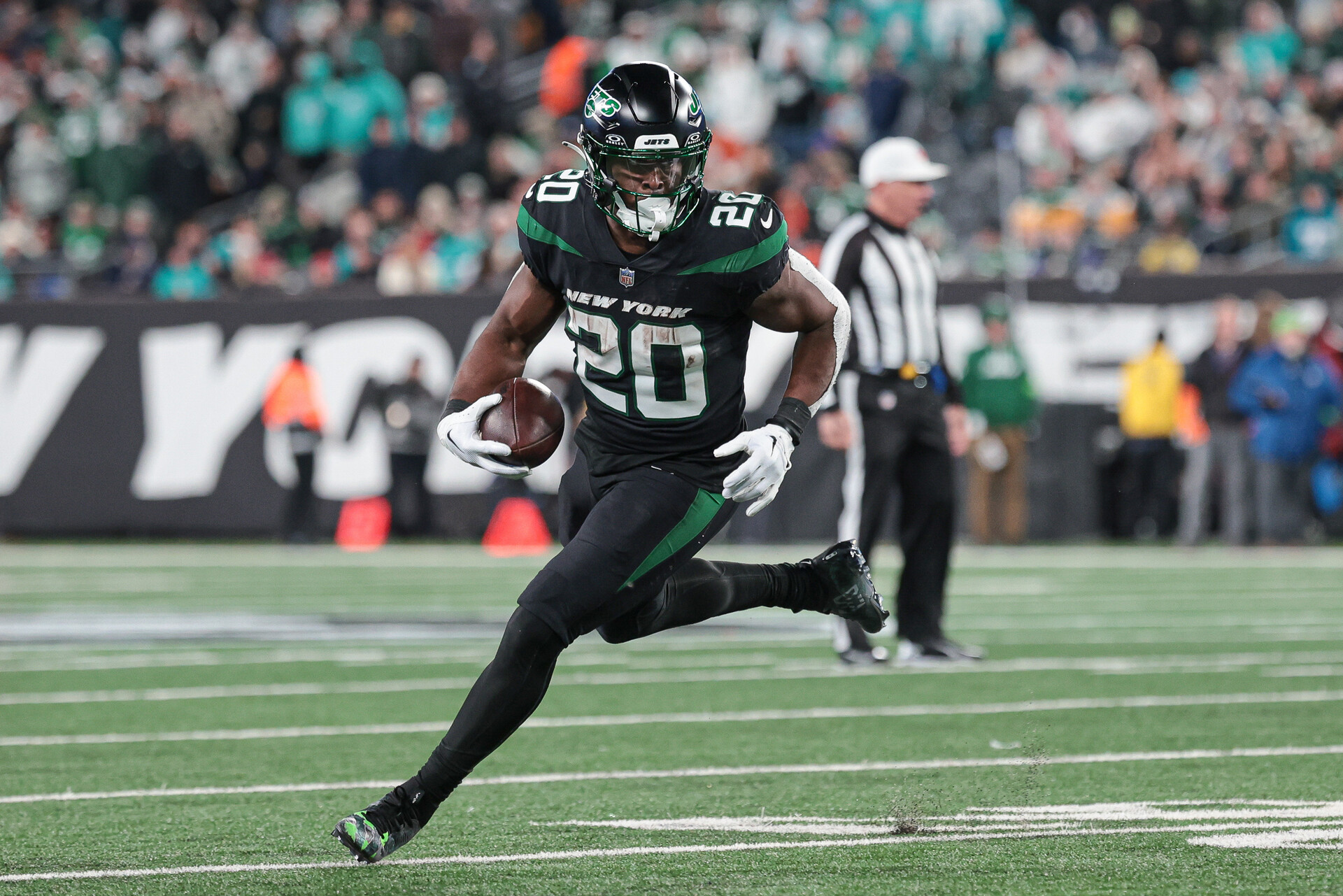 Nov 24, 2023; East Rutherford, New Jersey, USA; New York Jets running back Breece Hall (20) carries the ball during the second half against the Miami Dolphins at MetLife Stadium.